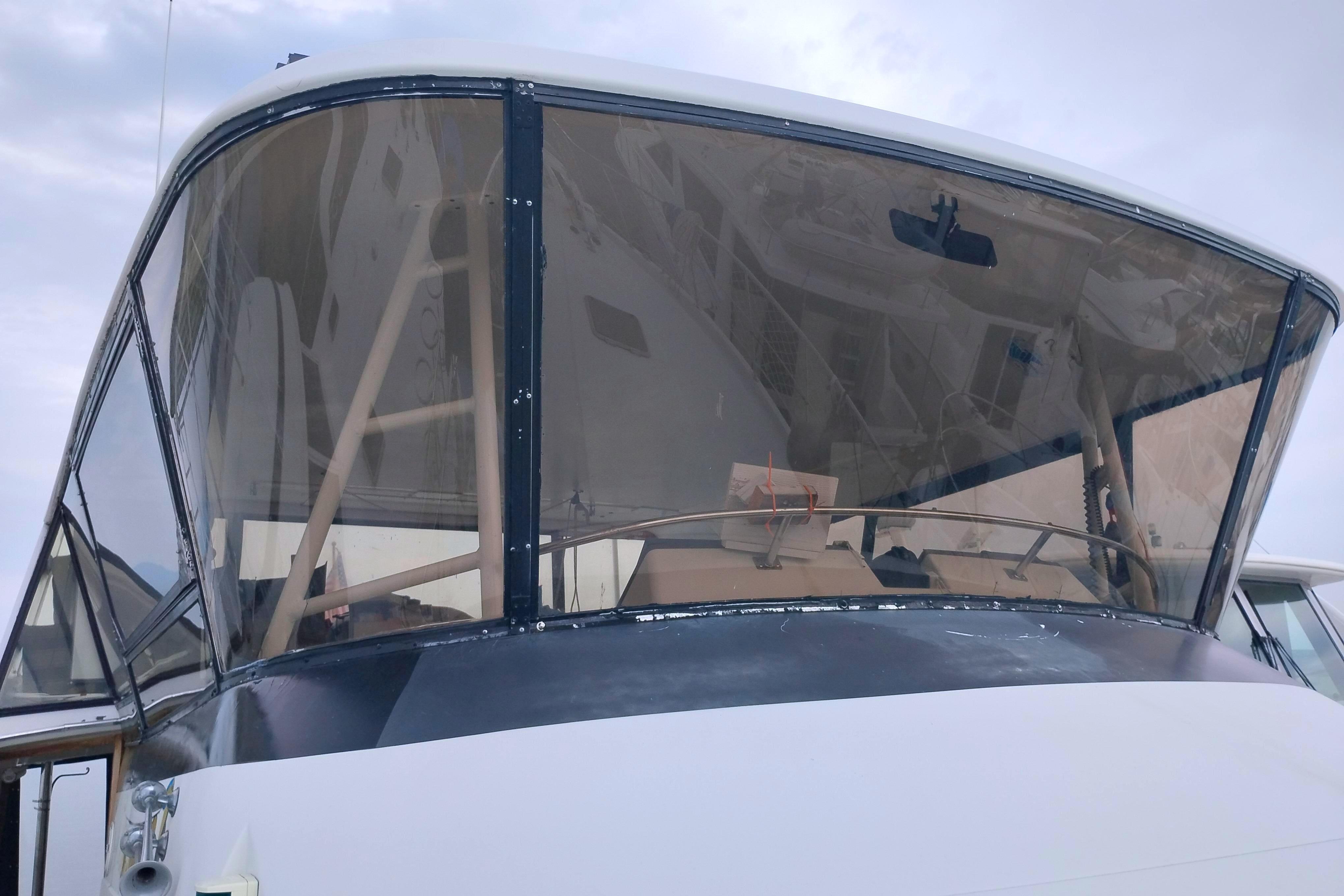 1991 Californian 52 Cockpit Motor Yacht with enclosed cockpit and clear windows.