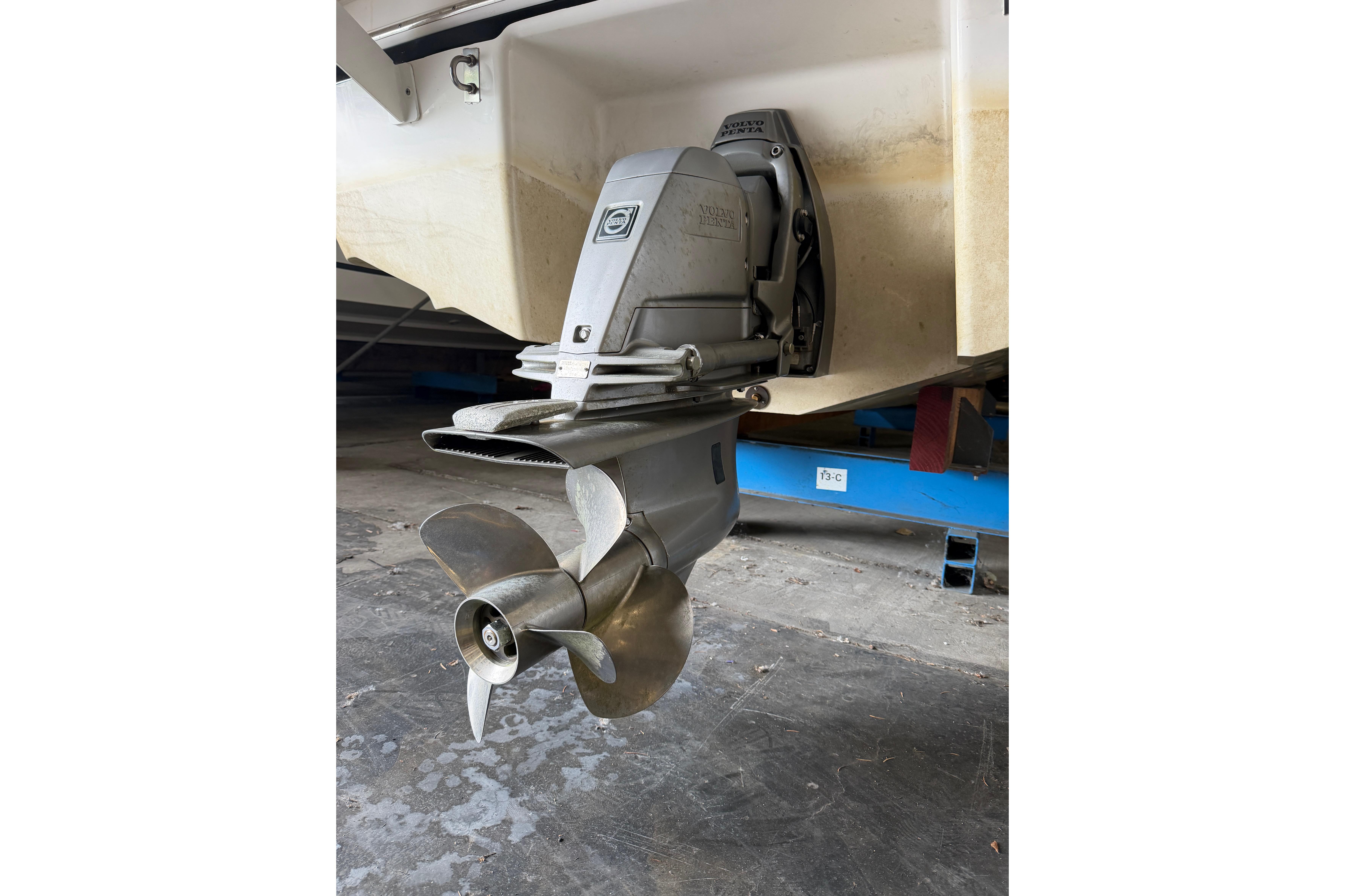 2023 Chaparral 247 SSX boat propeller and drive system in a garage setting.
