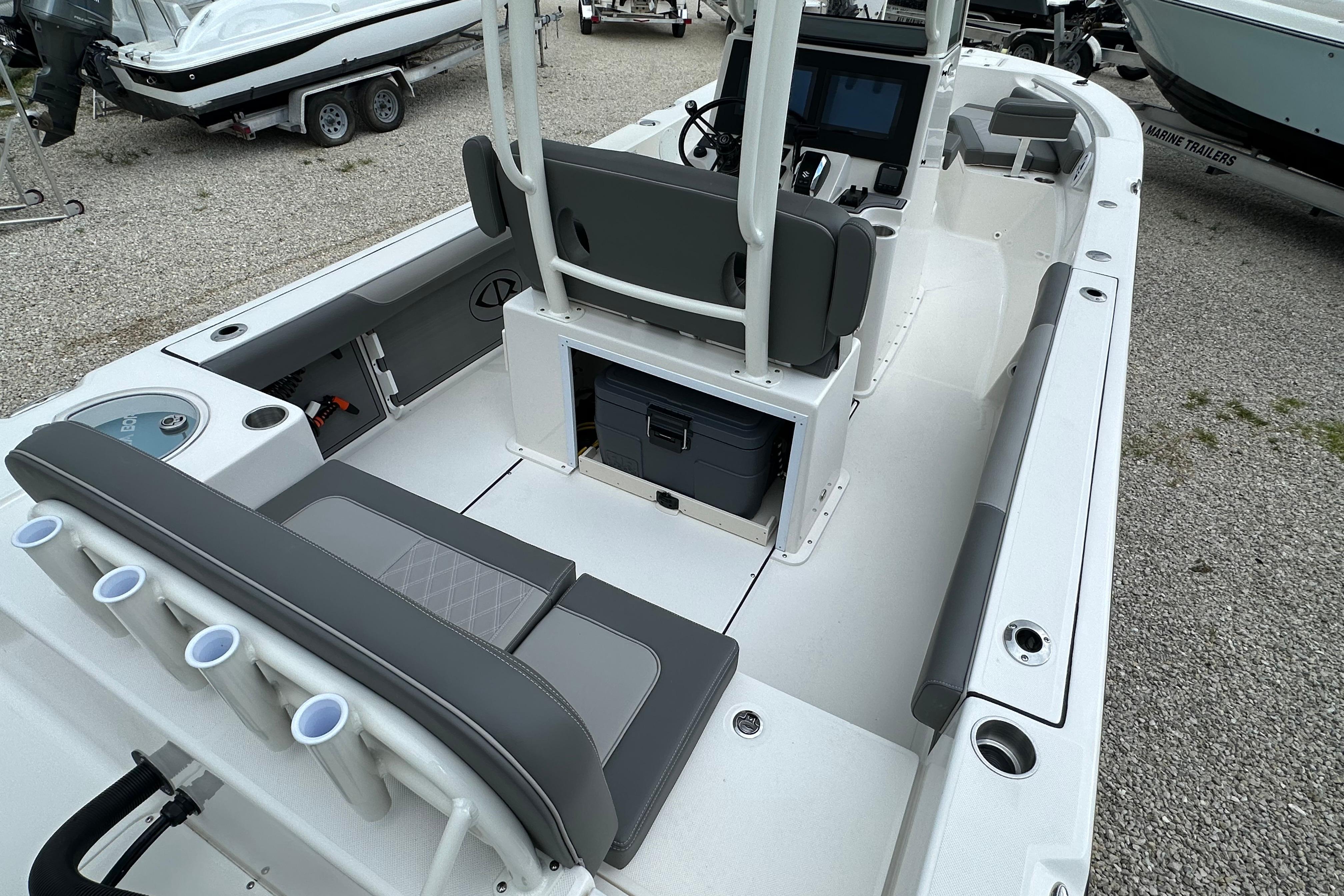 2027 Sea Born LX24 Center Console boat interior with seating and storage compartments.
