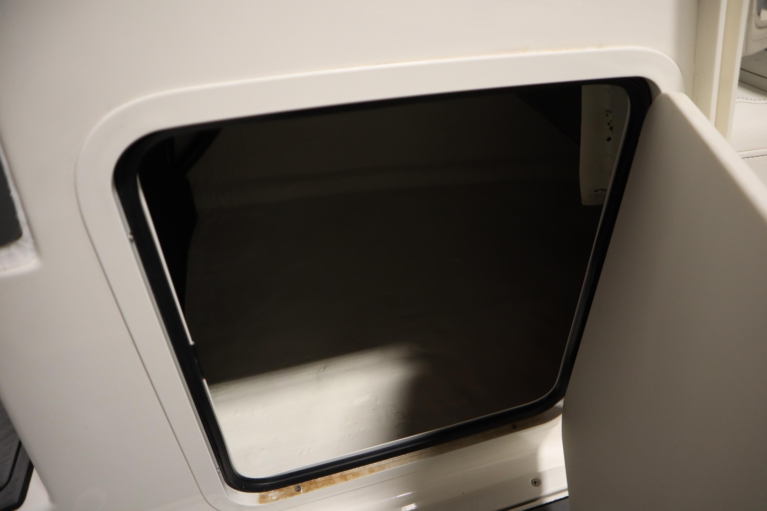 Open storage compartment on 2023 Heyday WT Surf boat.