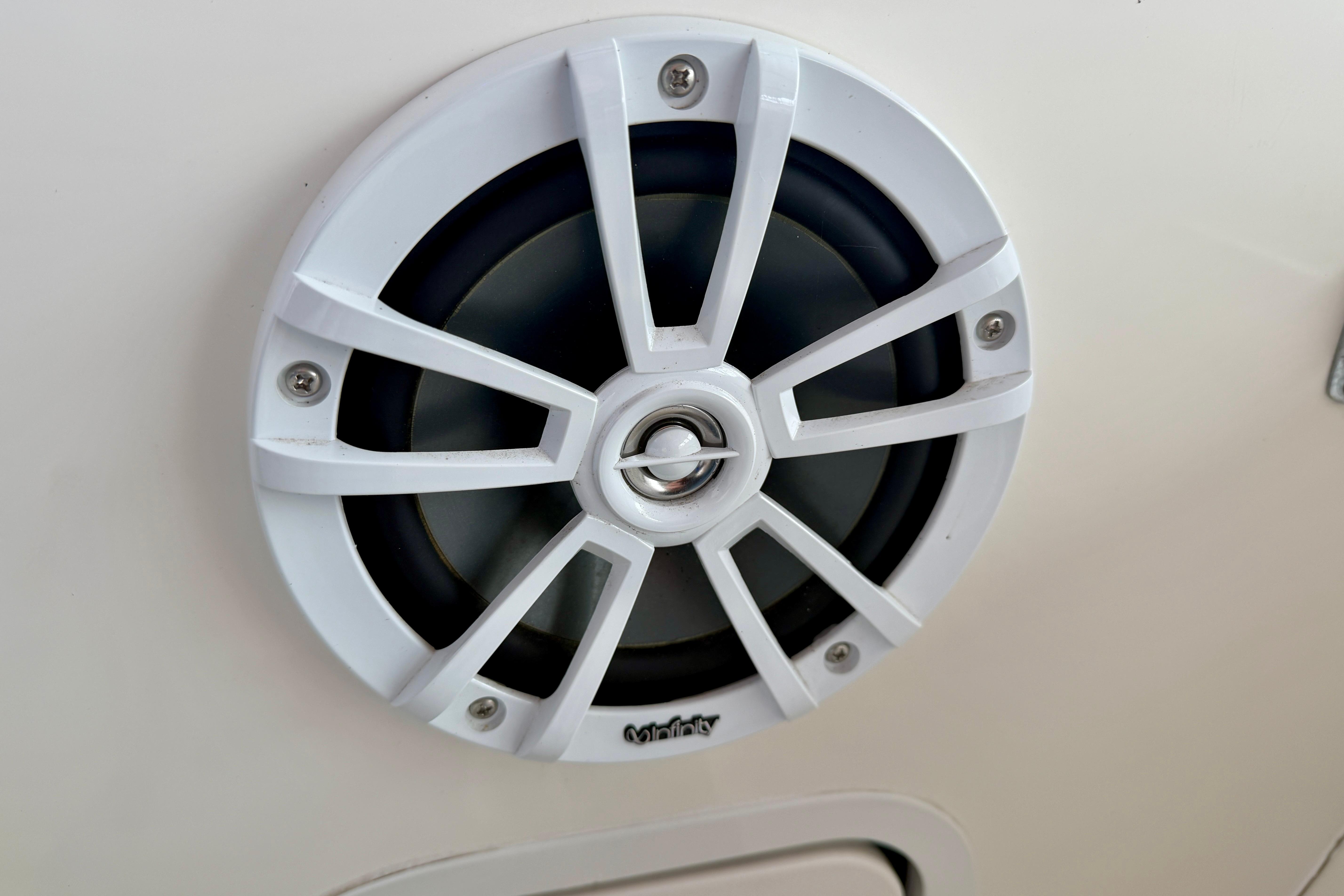 White marine speaker on a 1995 Sea Ray 370 Sundancer boat.