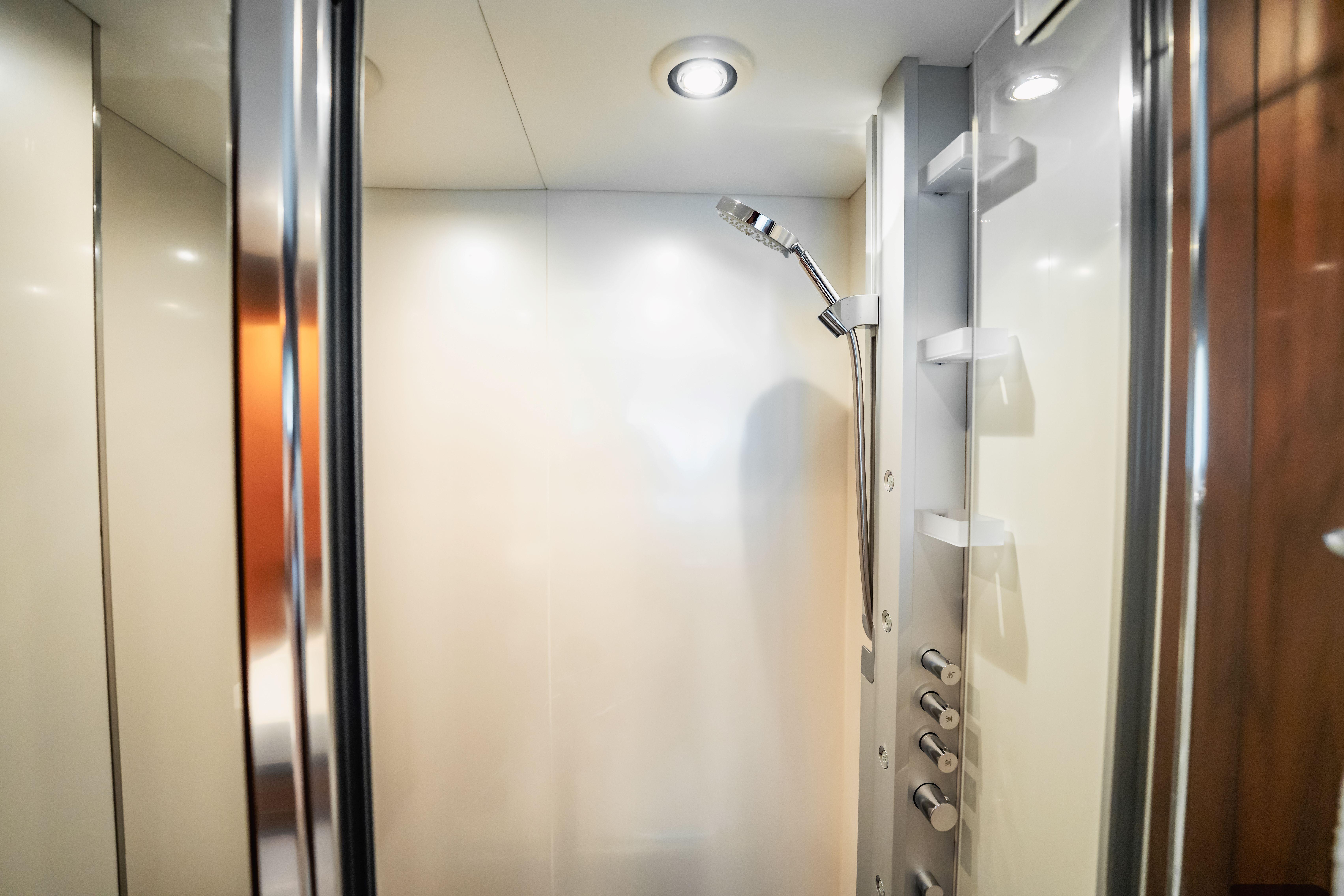 Luxurious shower area in 2011 Sunseeker 34 Metre Yacht, featuring modern fixtures and sleek design.