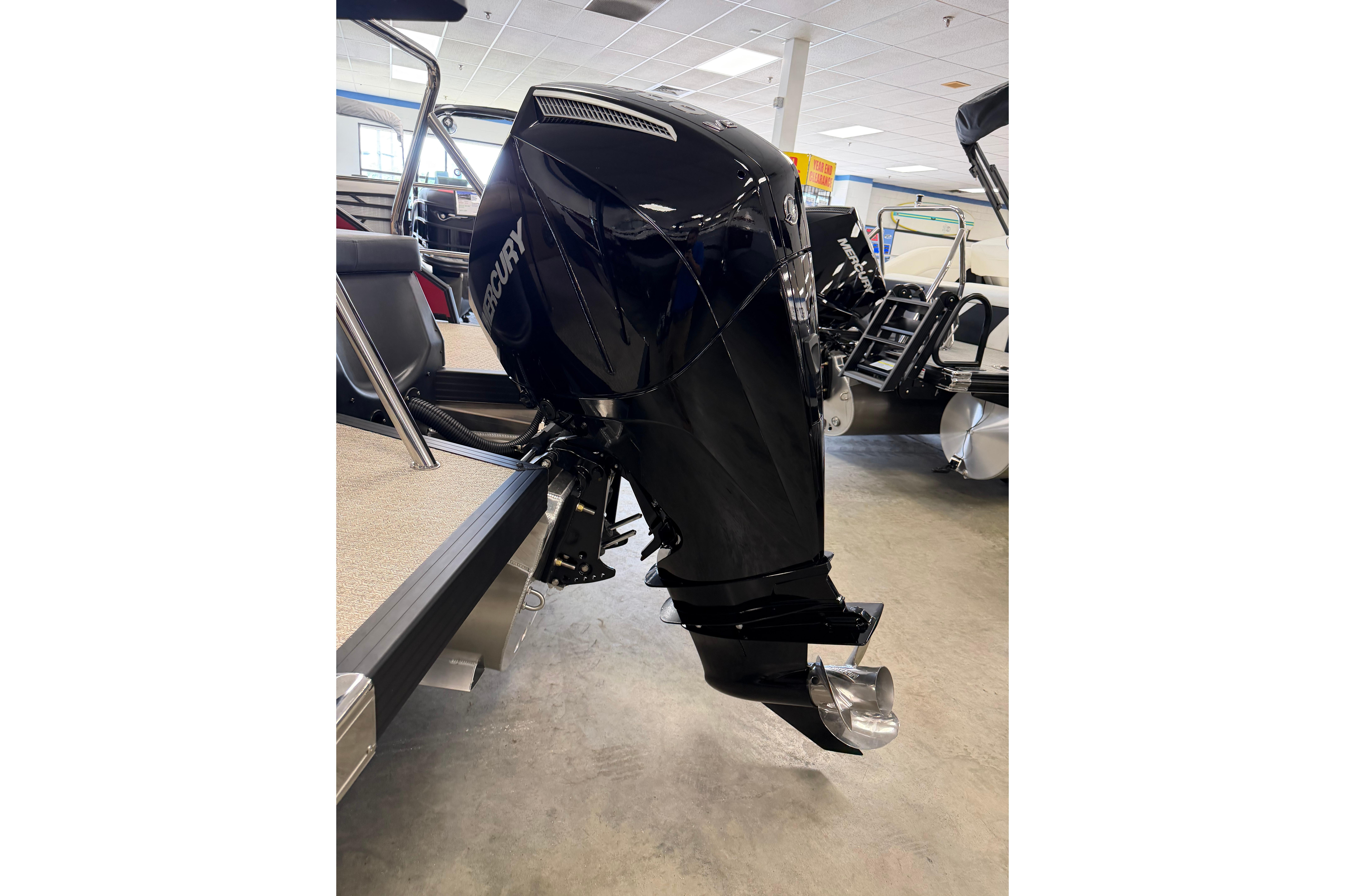 2026 Evotti 523CS boat with Mercury outboard motor in showroom.