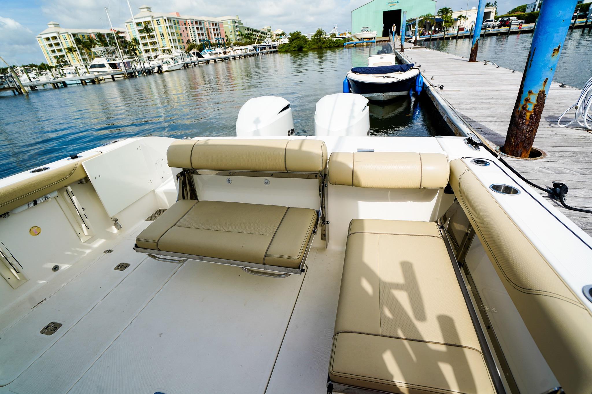 2020 Pursuit OS 325 Offshore boat interior at marina dock.