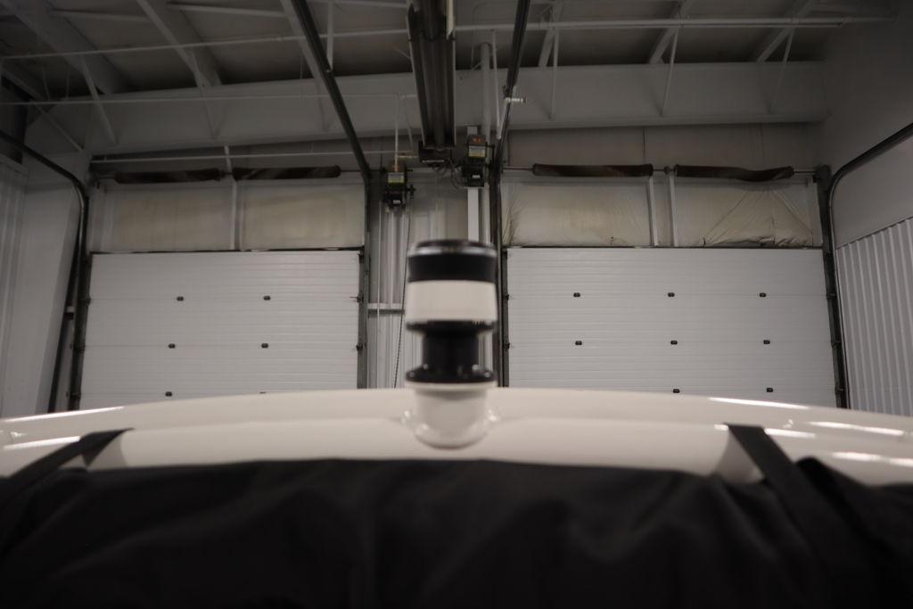 2026 Yamaha Boats 195S in a garage, showcasing its sleek design and modern features.