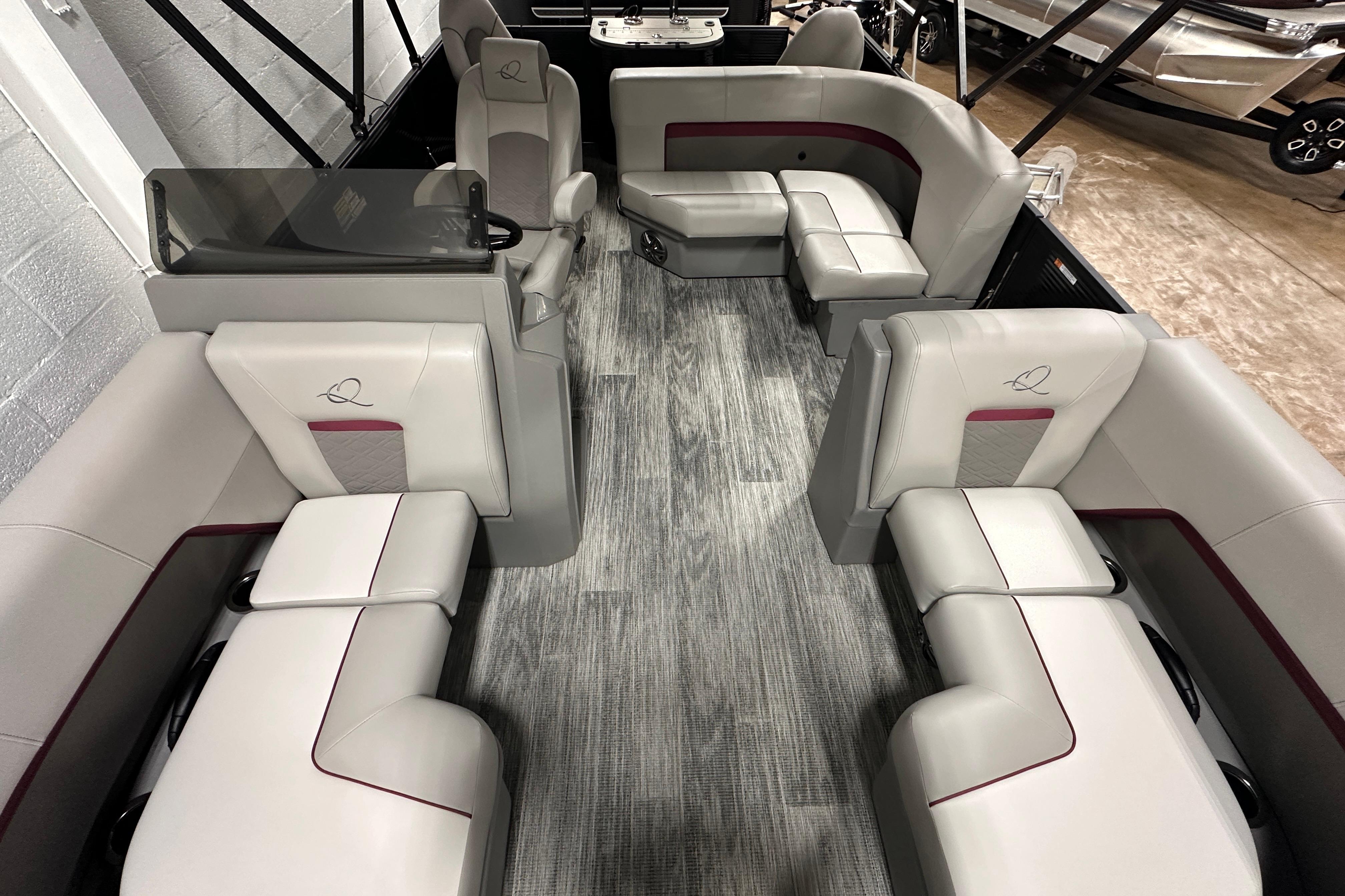 2025 Qwest 18 XRE Cruise boat interior with luxurious seating and modern design.