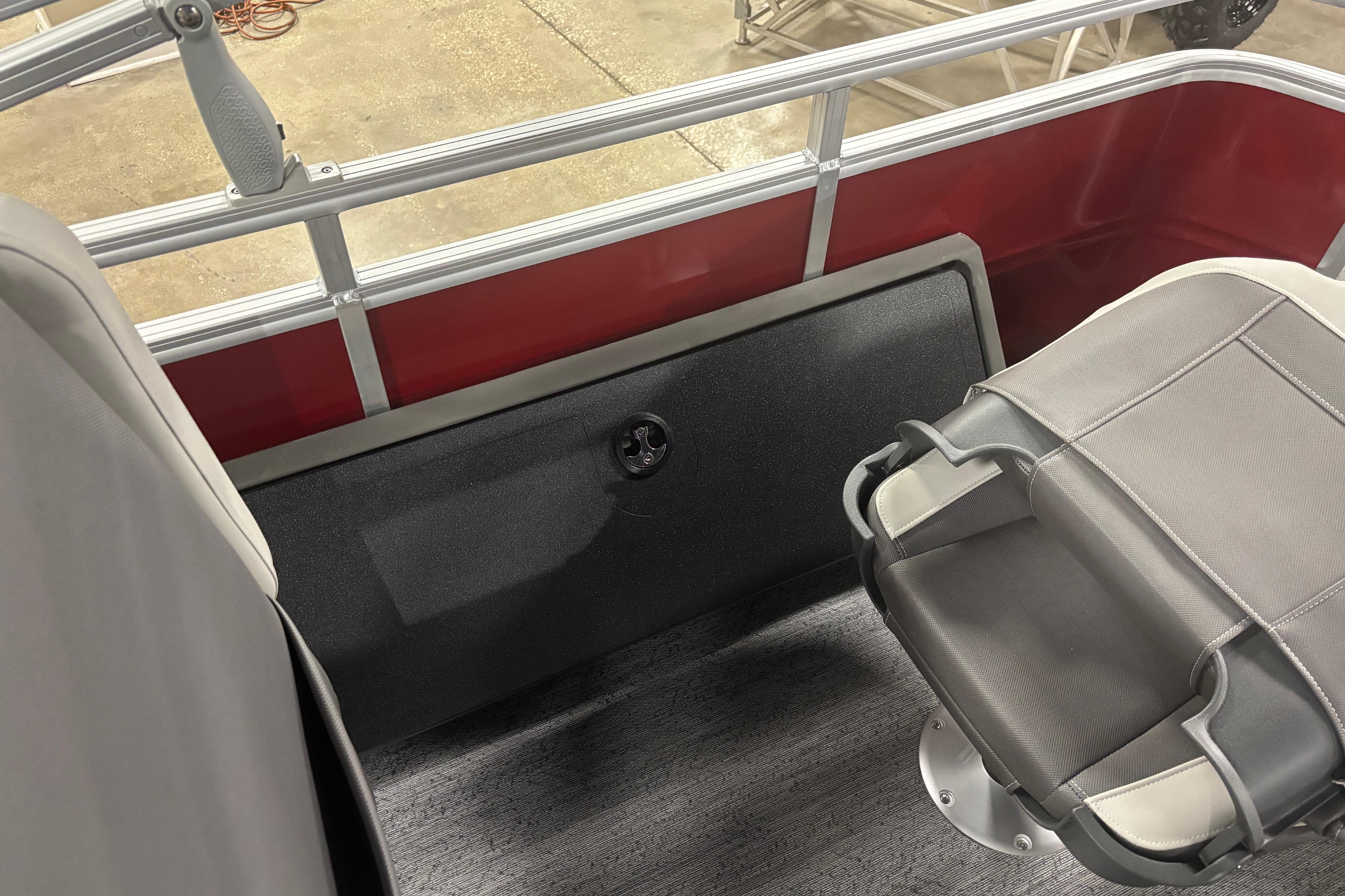 2026 Sun Tracker Fishin' Barge 22 DLX interior with seating and railing details.
