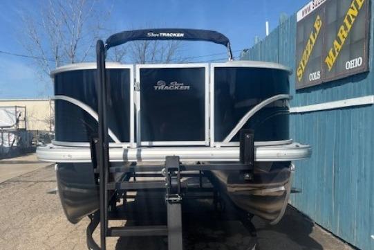 2026 Sun Tracker Party Barge 18 DLX pontoon boat on trailer, outdoor display.