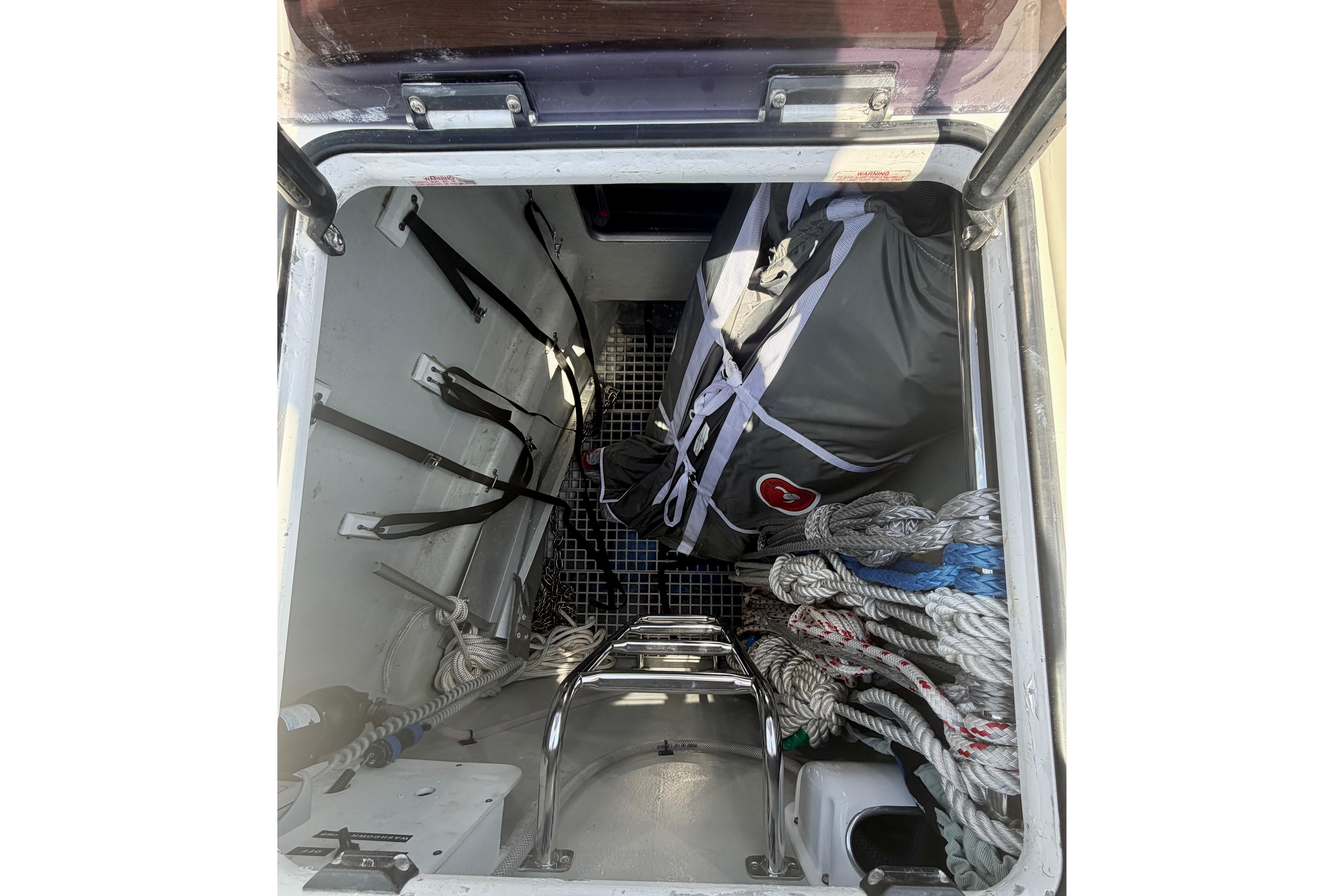 Storage compartment of a 2016 Hanse 455 yacht with ropes and equipment.