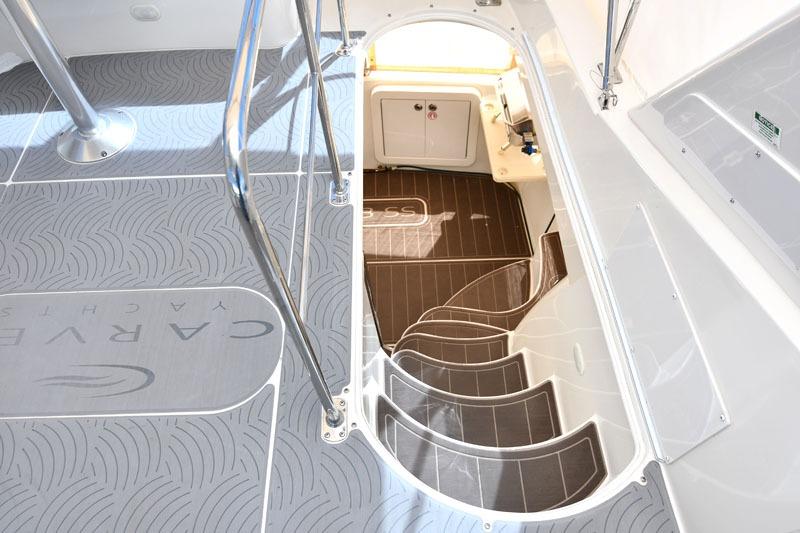 Staircase leading below deck on 2008 Carver 43 Super Sport yacht.