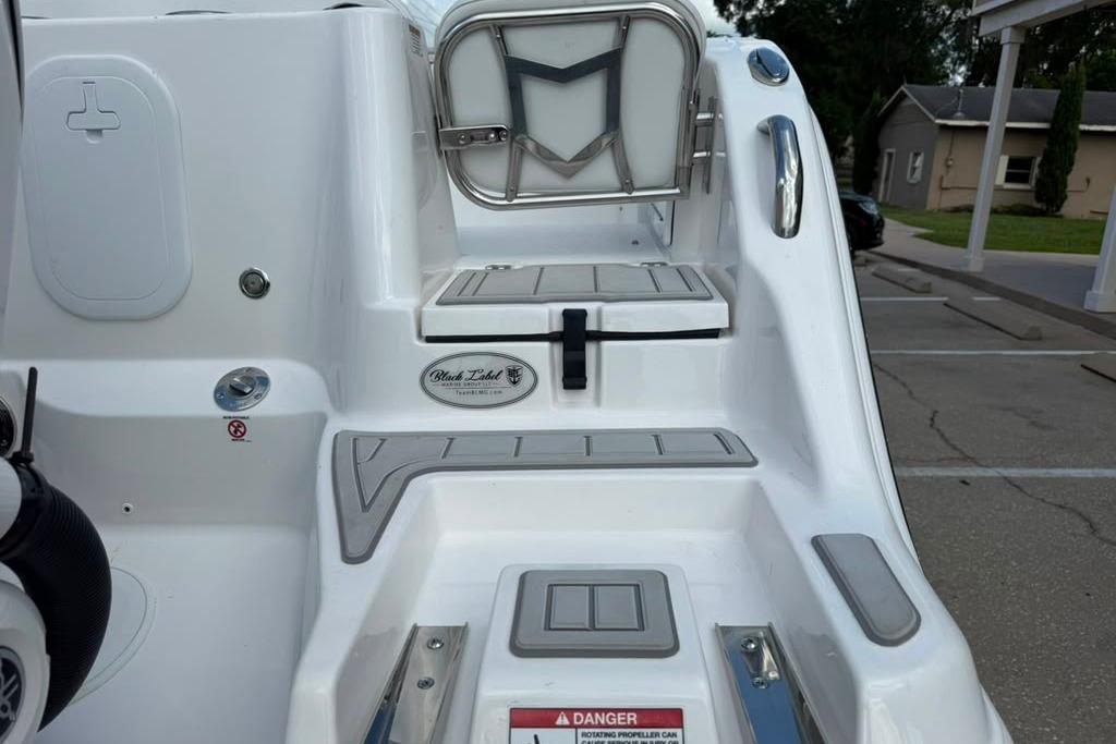 2026 Sea Fox 288 Traveler boat deck with seating and safety features.