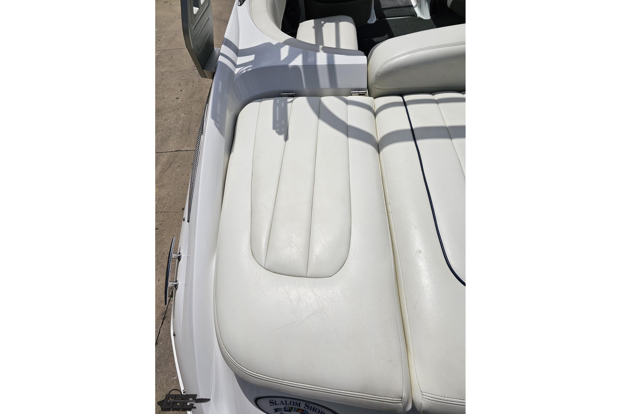 White leather seating on a 2010 Cobalt 232 WSS boat, showcasing luxury and comfort.