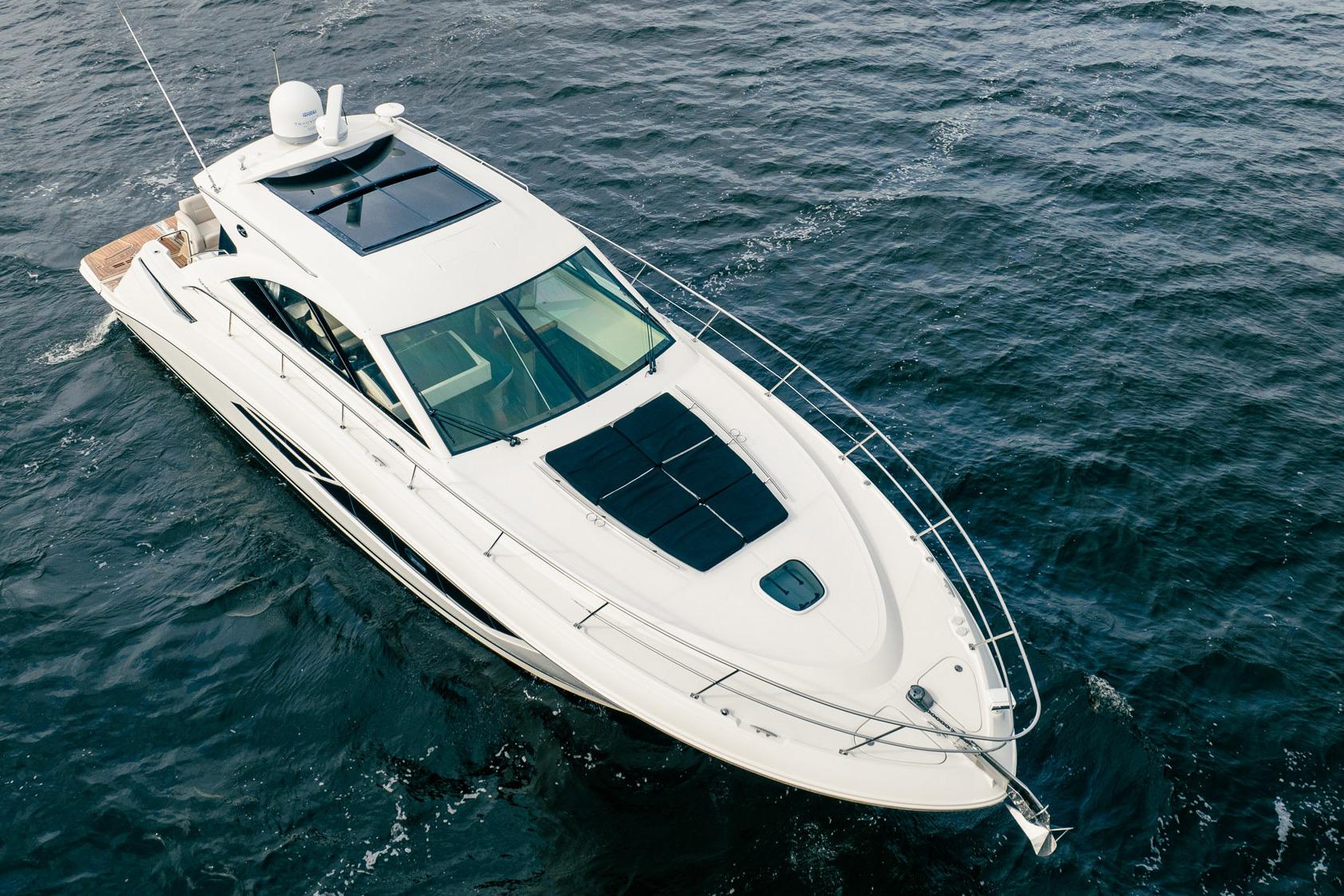 2015 Sea Ray 510 Sundancer yacht cruising on open water, aerial view.