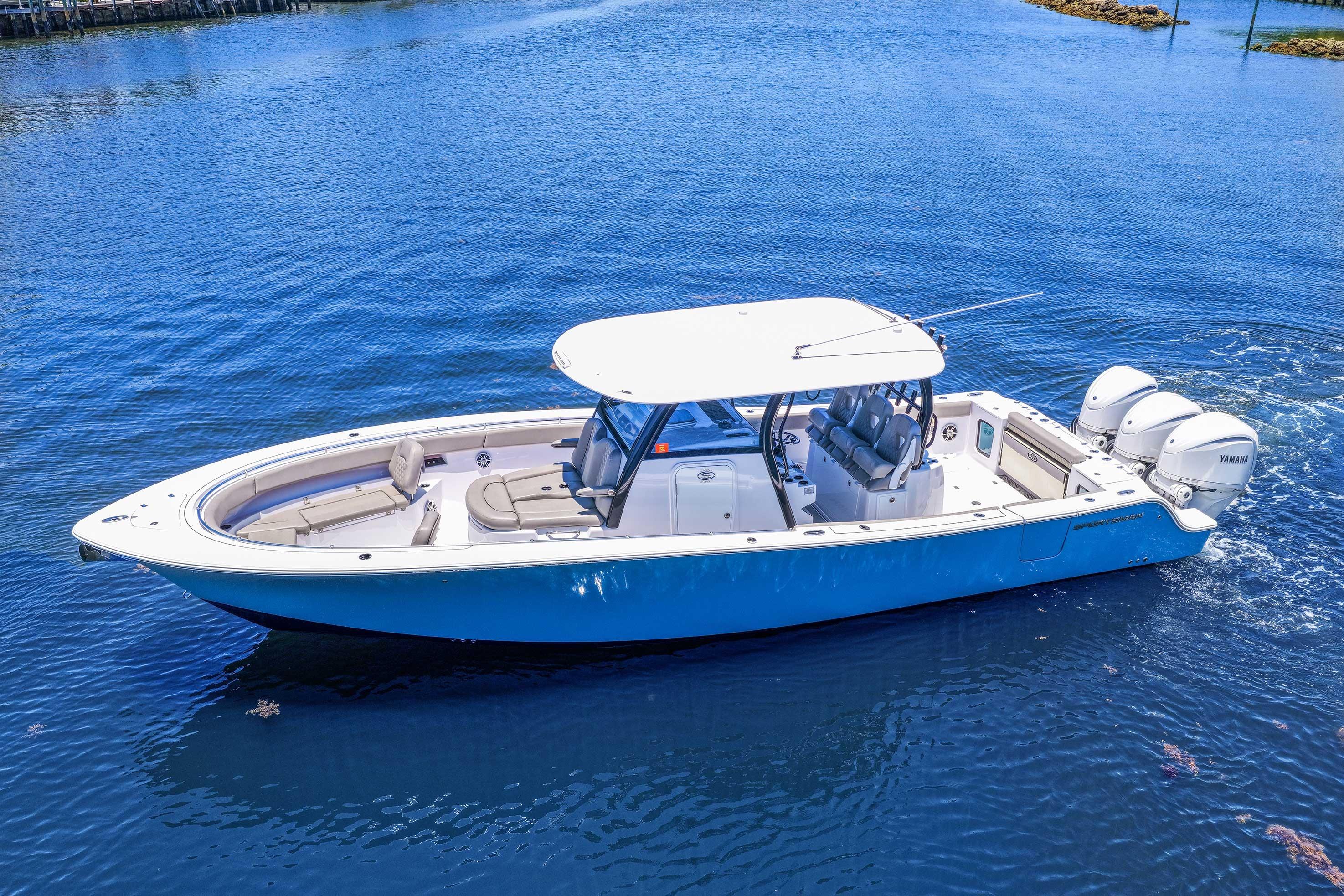 2024 Sportsman Open 352 Center Console boat on calm blue water.
