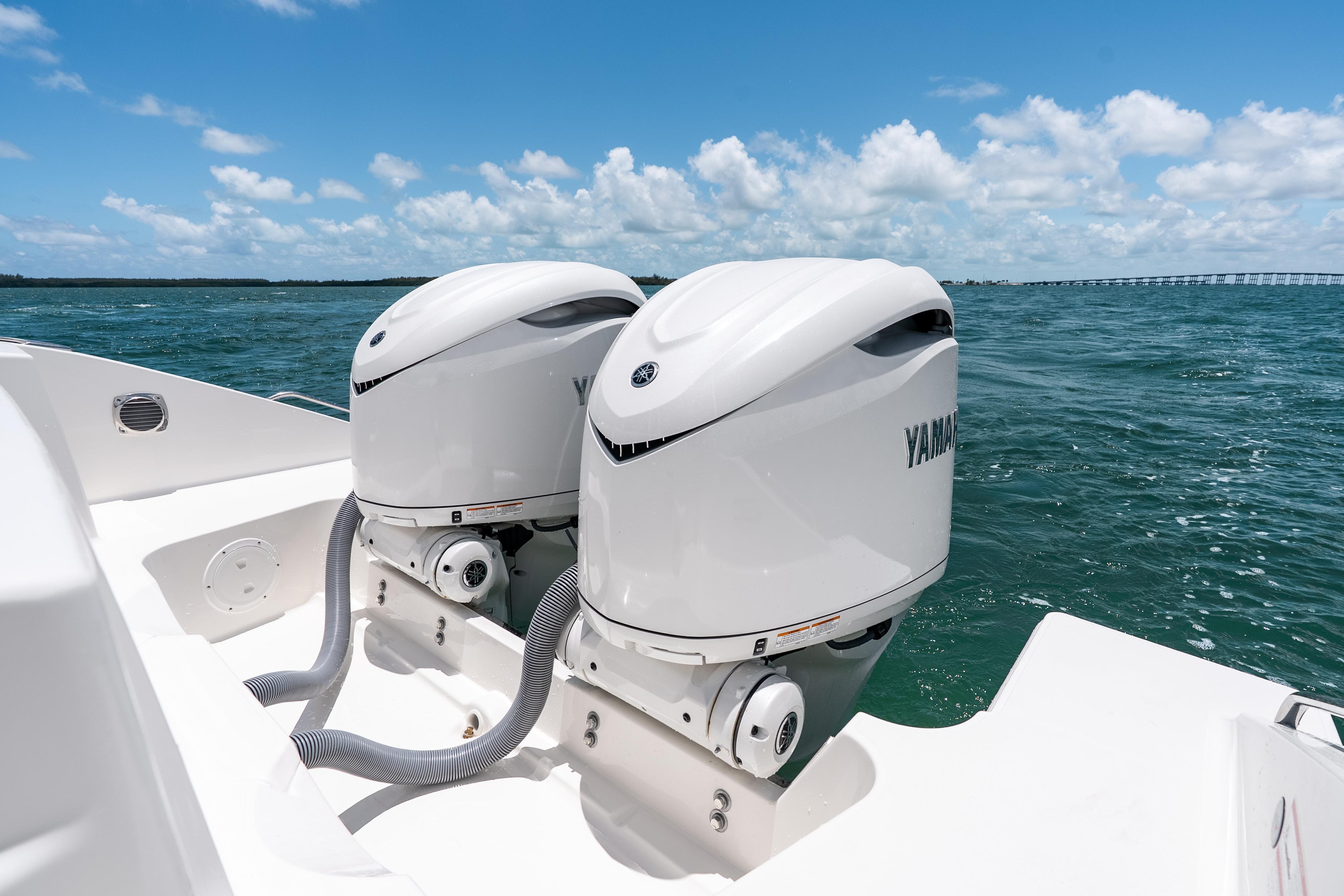 2026 Pursuit DC 326 Dual Console with Yamaha outboard engines on open water.