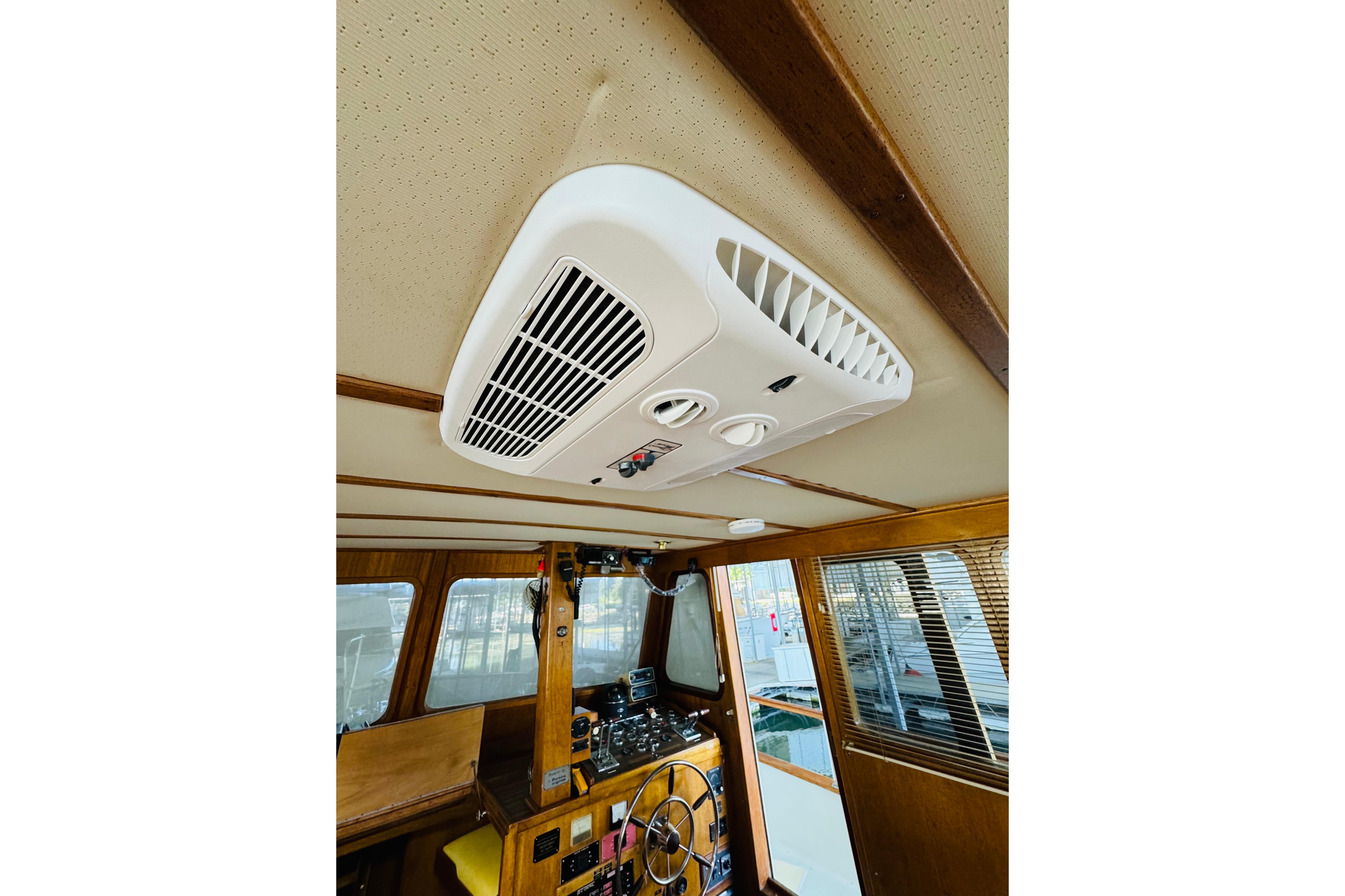 1978 Californian 42 LRC boat interior with ceiling air vent and wooden paneling.