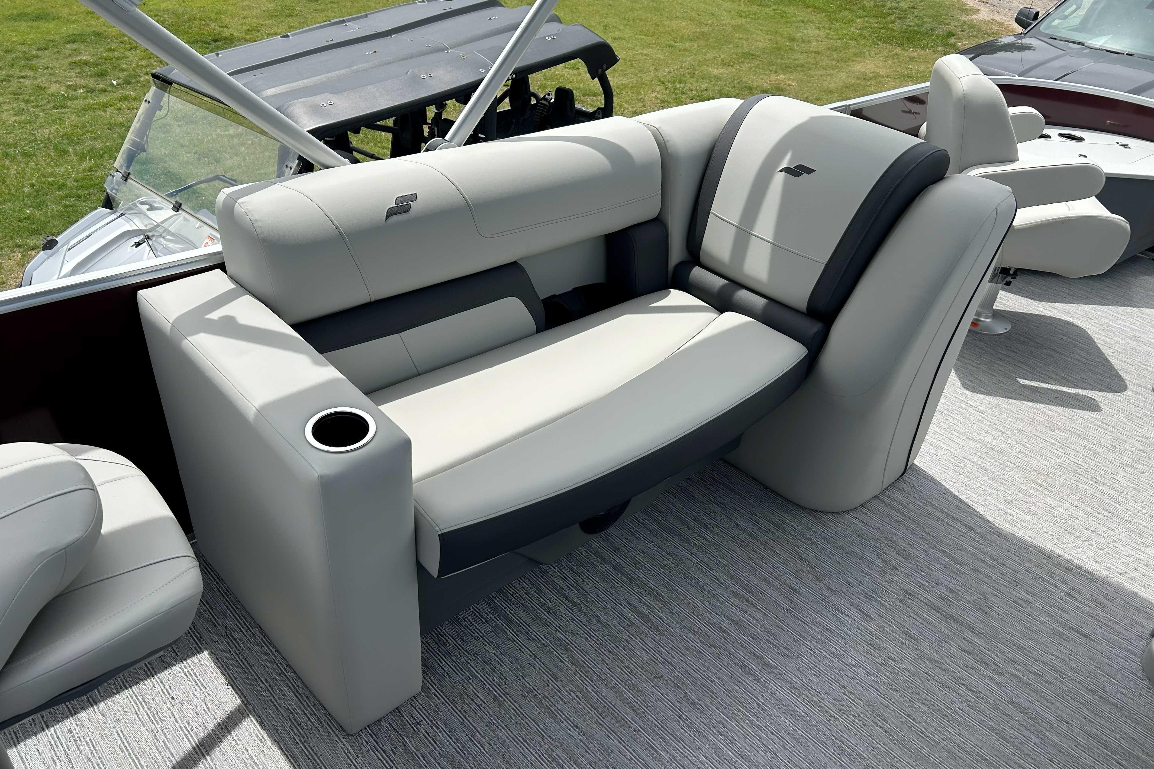 Luxurious seating on 2026 Starcraft EX 20 F boat with cup holder and modern design.