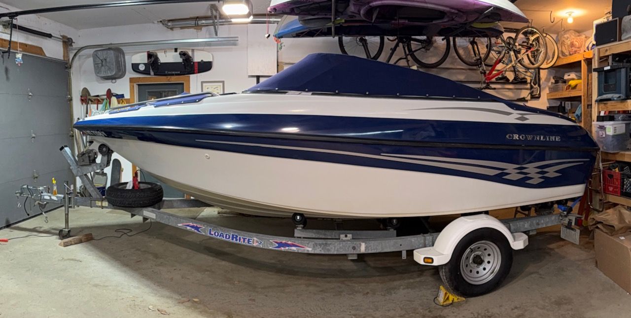 2000 Crownline 192 BR boat on trailer in garage.