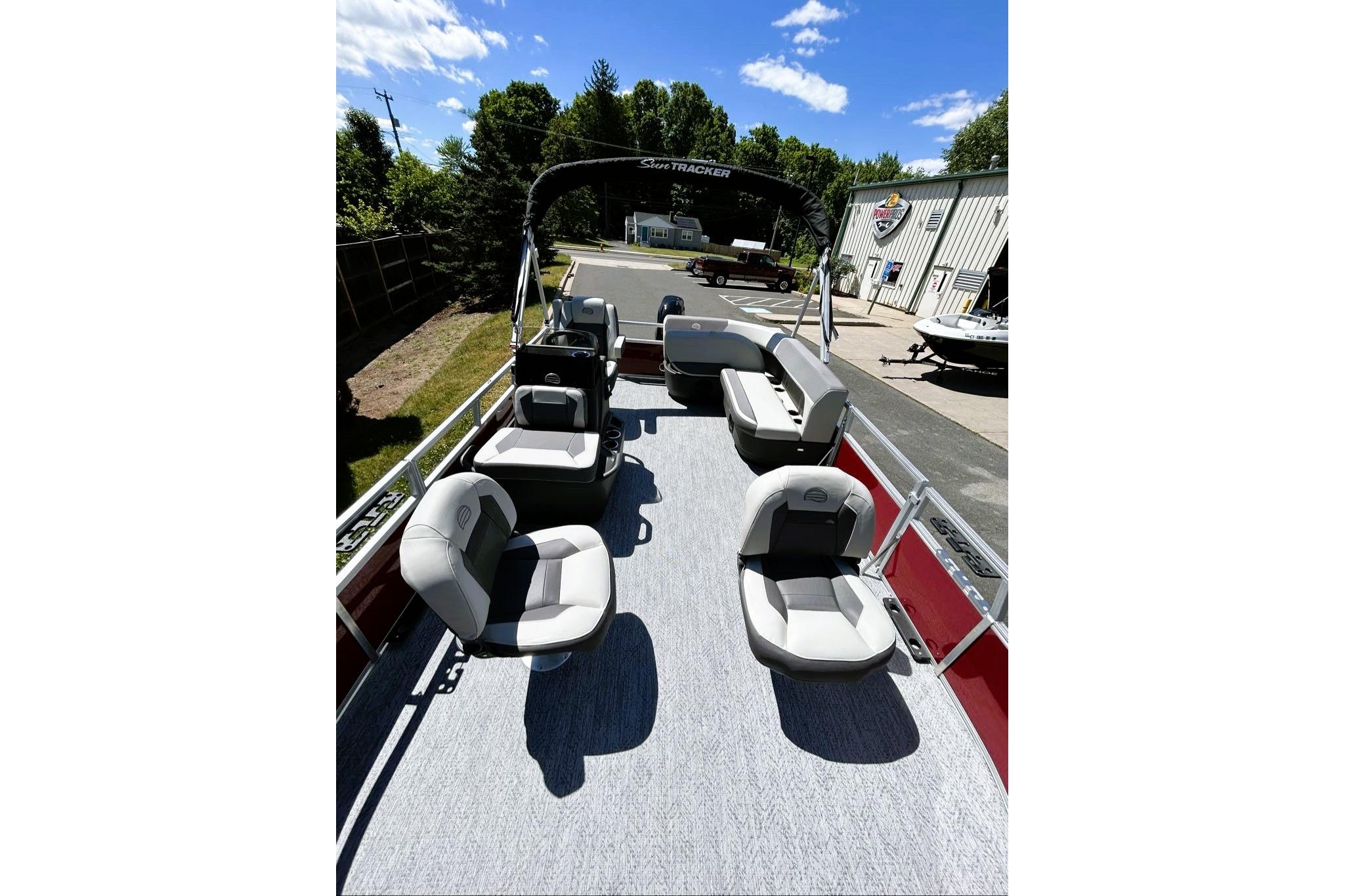 2026 Sun Tracker Bass Buggy 16 XL Select pontoon boat with spacious seating and modern design.