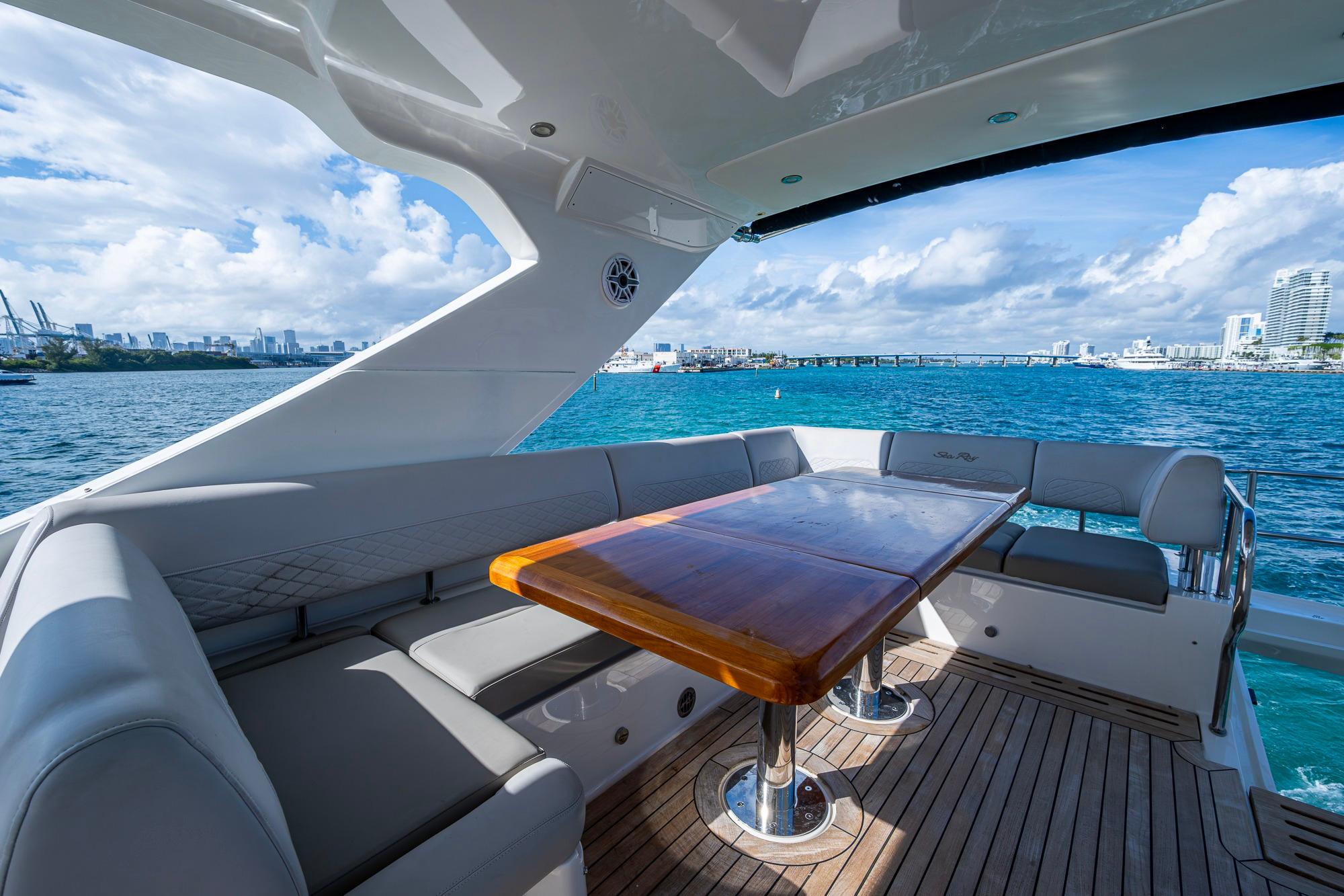 Luxurious 2018 Sea Ray L550 Fly yacht with elegant seating and ocean view.