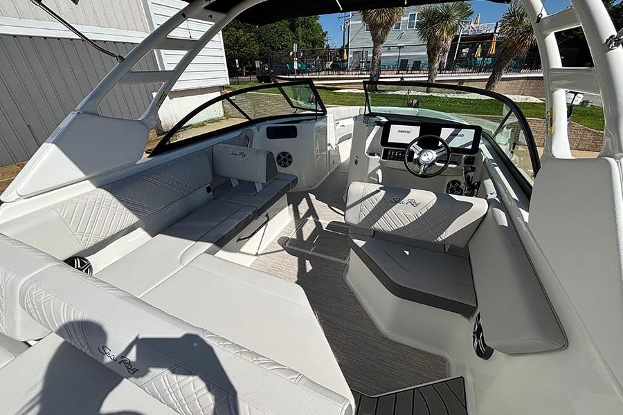 2027 Sea Ray SDX 230 Outboard boat interior with modern seating and steering console.