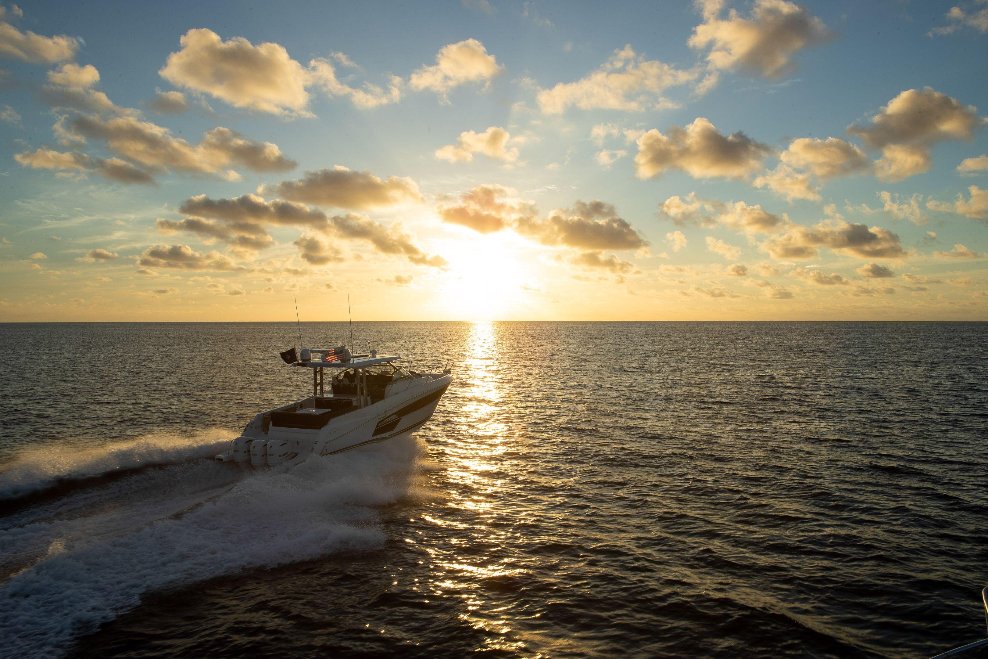 2026 Jeanneau Leader 12.5 WA cruising at sunset on open sea.