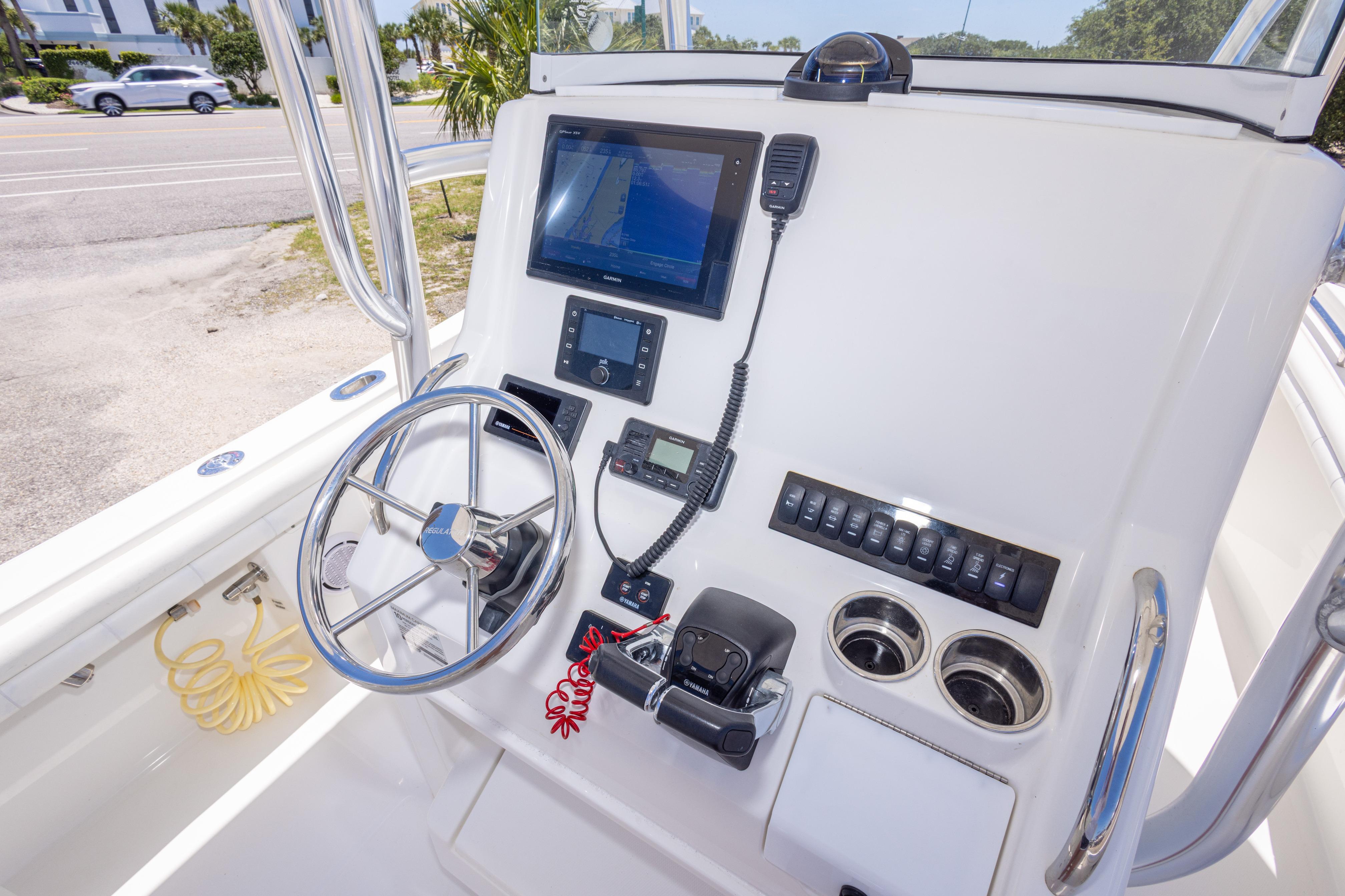2019 Regulator 23 Center Console boat dashboard with steering wheel and navigation equipment.