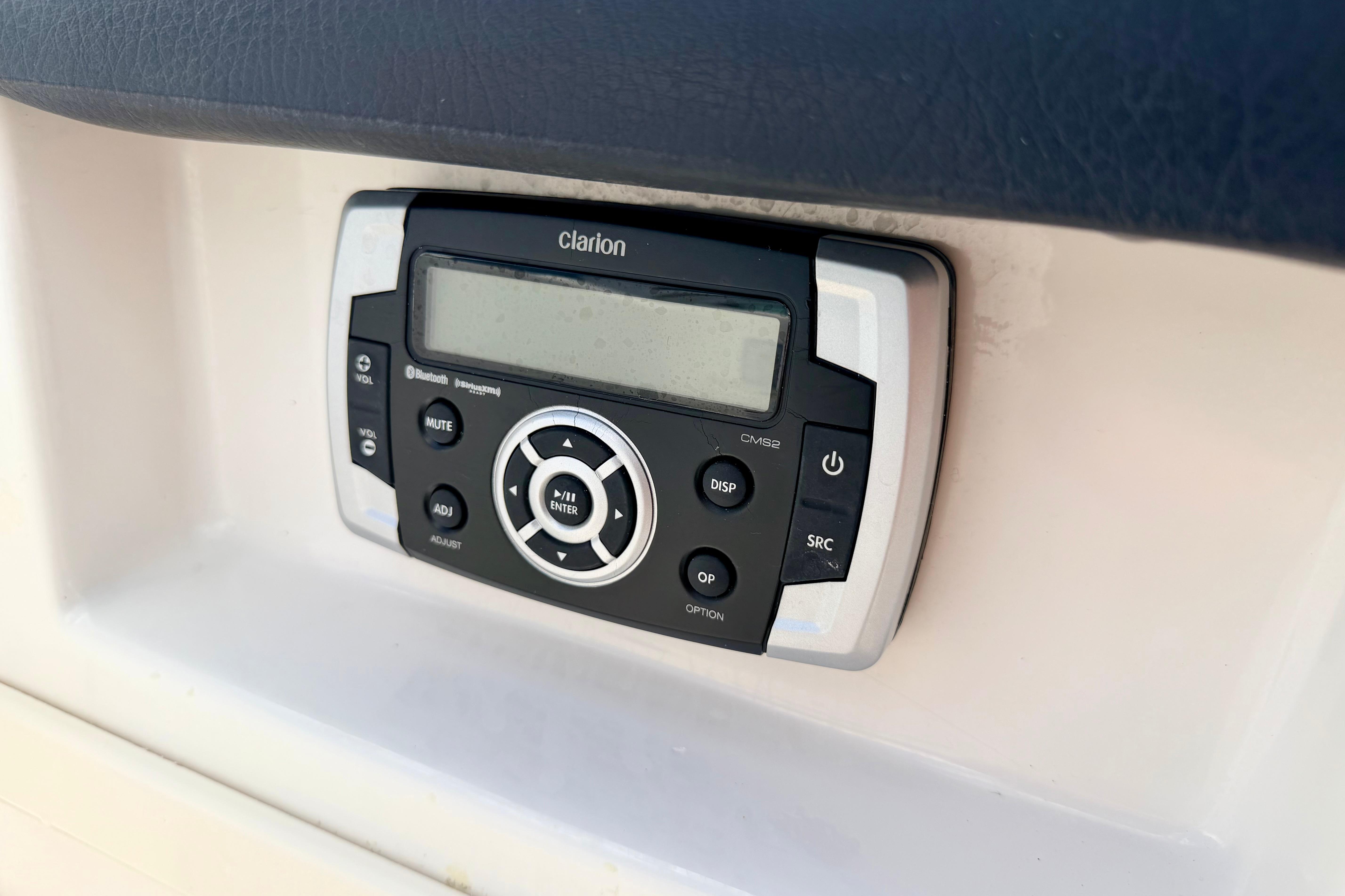 Clarion audio system in 2015 Chaparral Sunesta 264 boat dashboard.