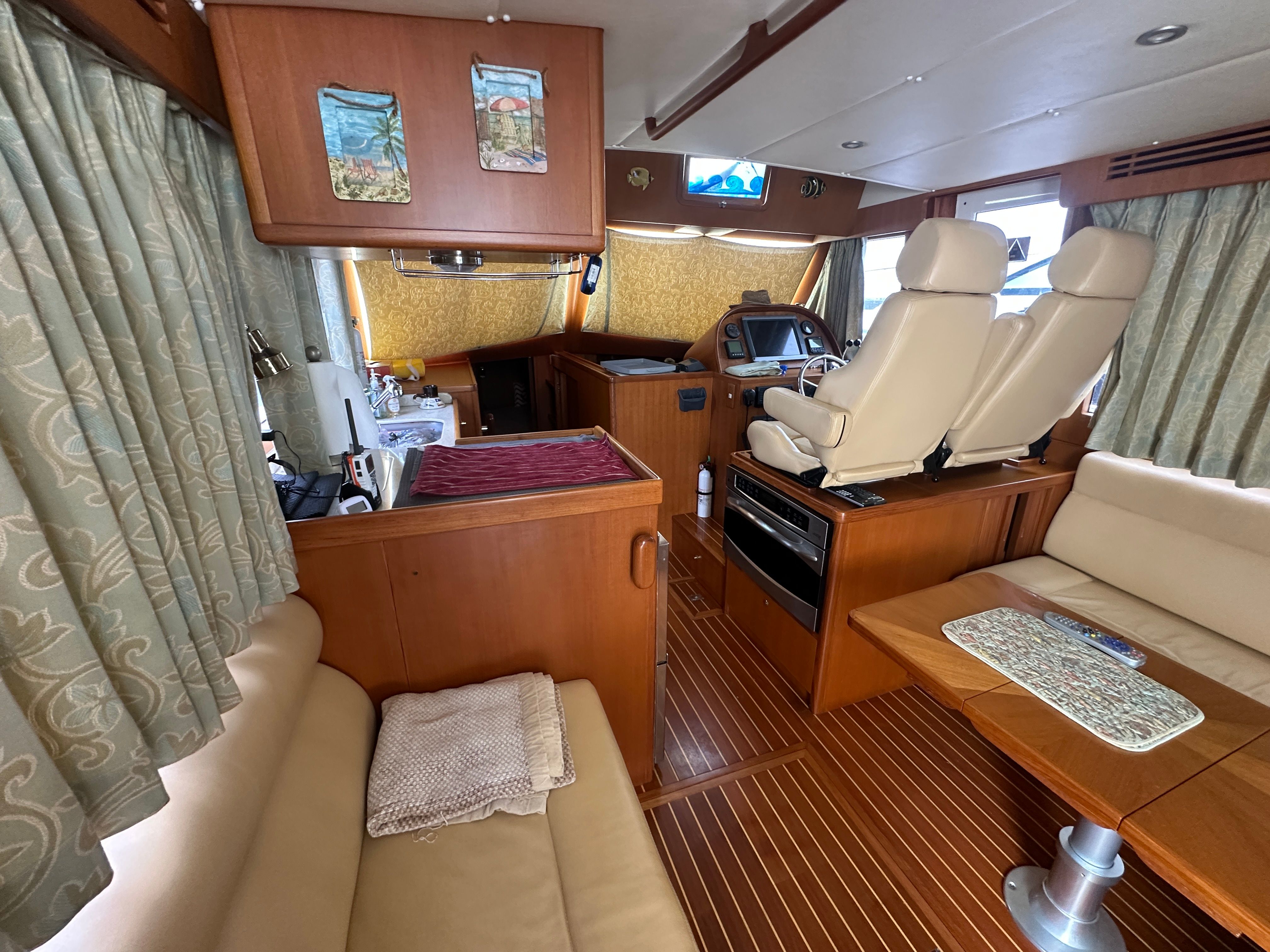 Interior of a 2009 Island Pilot 435 yacht with wooden furnishings.