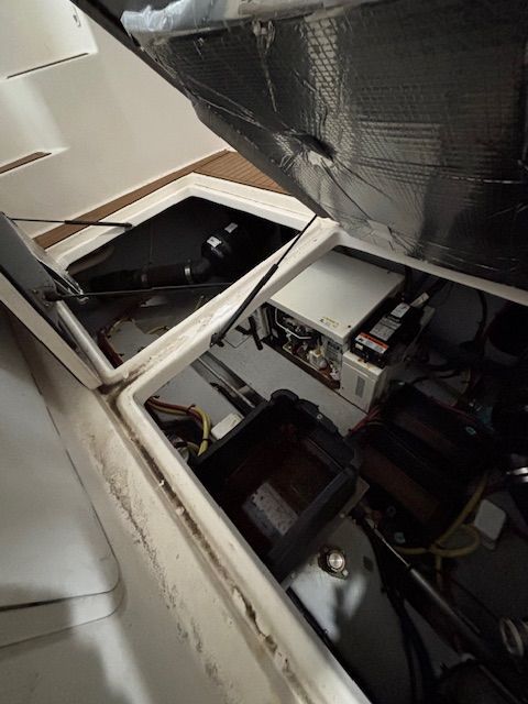 A view inside the engine compartment of a 2004 Meridian 341 Sedan.