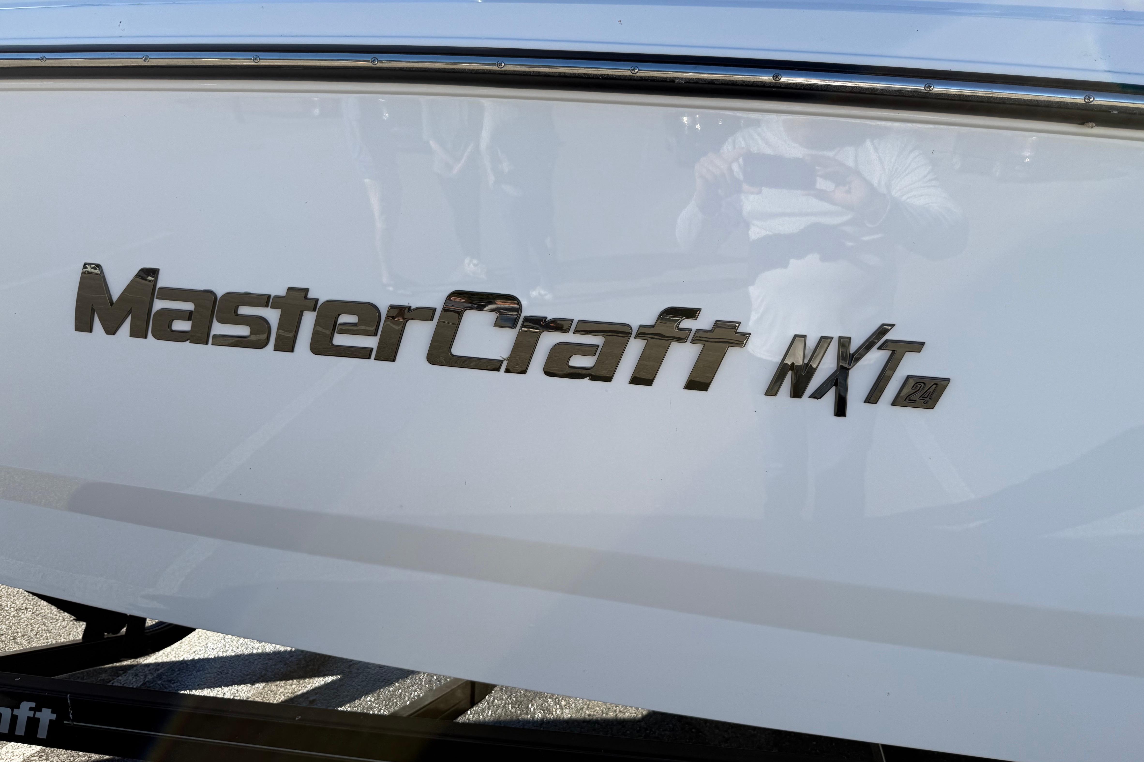 2022 MasterCraft NXT24 boat logo on white hull.