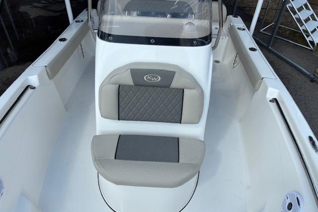 2026 Key West 189 FS boat interior with cushioned seating and console.