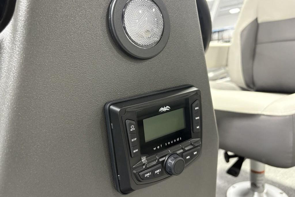 2026 Sun Tracker Bass Buggy 18 DLX audio system with speaker and control panel.