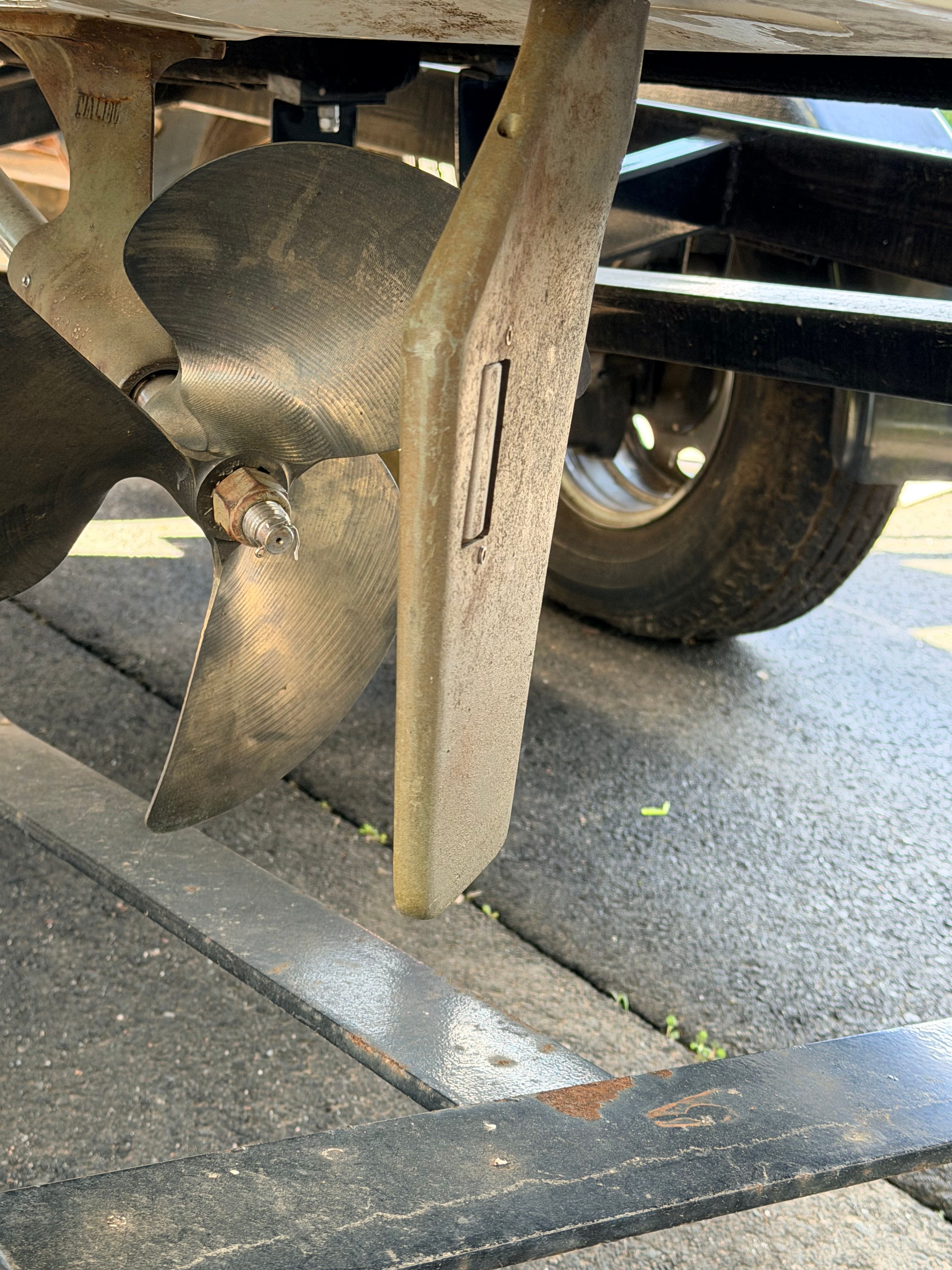 Close-up of a 2006 Malibu iRide boat propeller on a trailer.