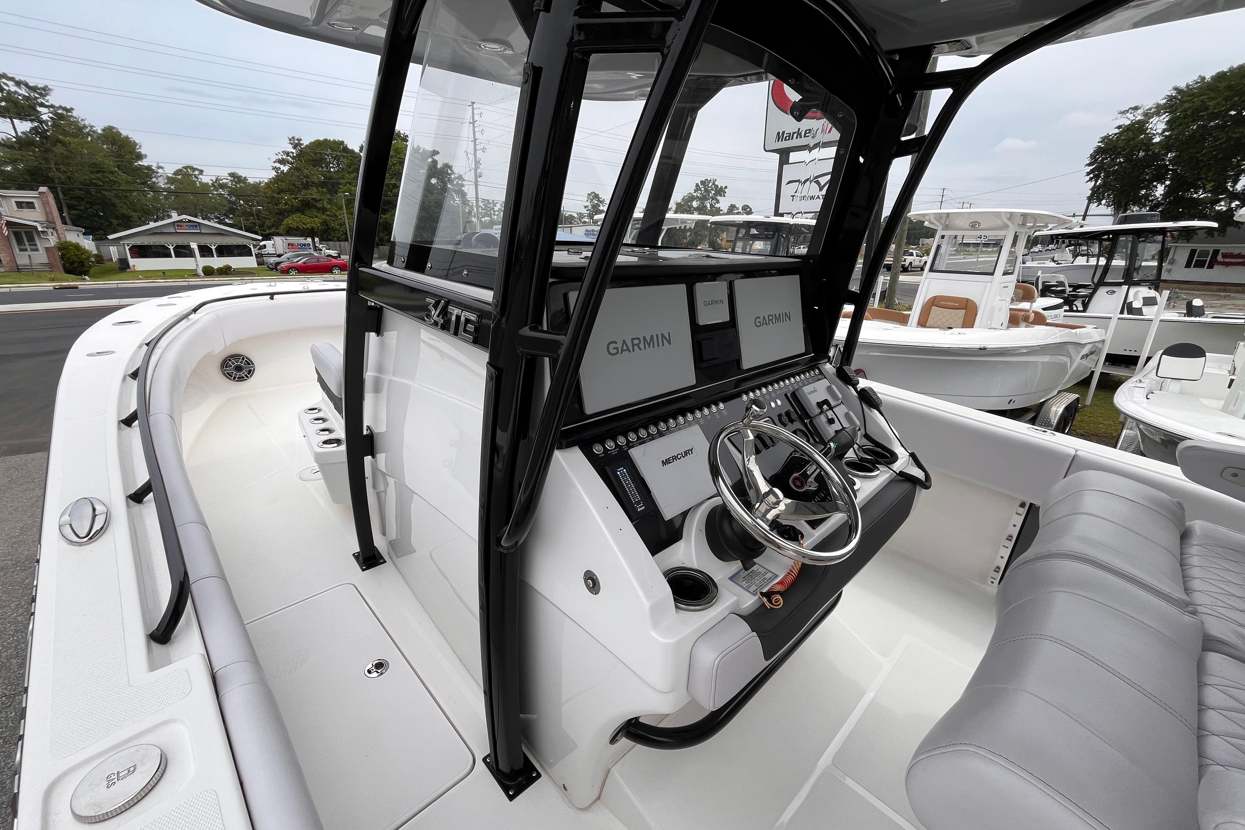 2024 Fountain 34 Tournament Edition boat cockpit with Garmin displays and Mercury controls.