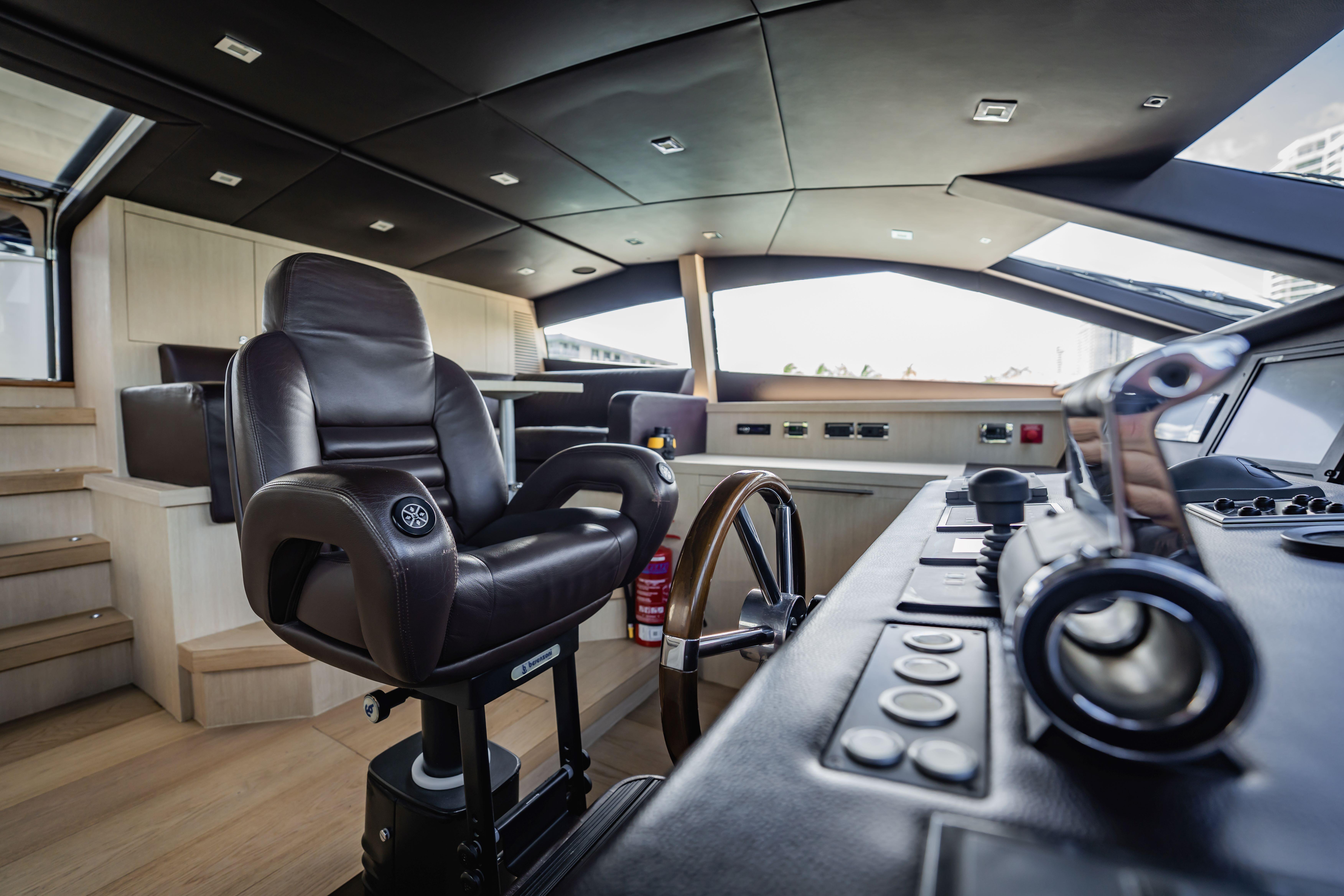 Luxurious helm of 2011 Sunseeker 34 Metre Yacht with leather captain's chair.