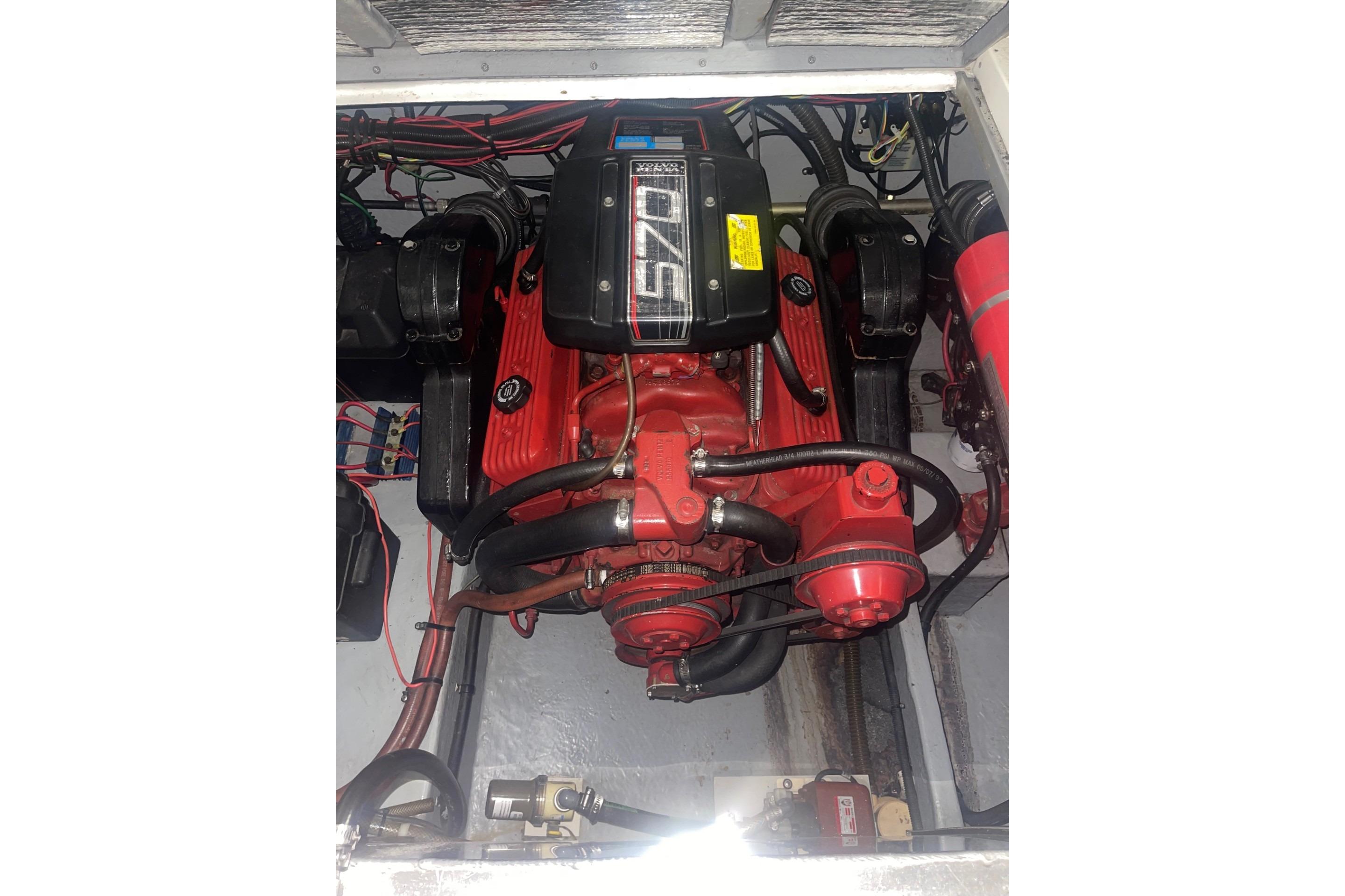 Engine compartment of a 1992 Chaparral Signature 30 boat, featuring a red 570 engine.