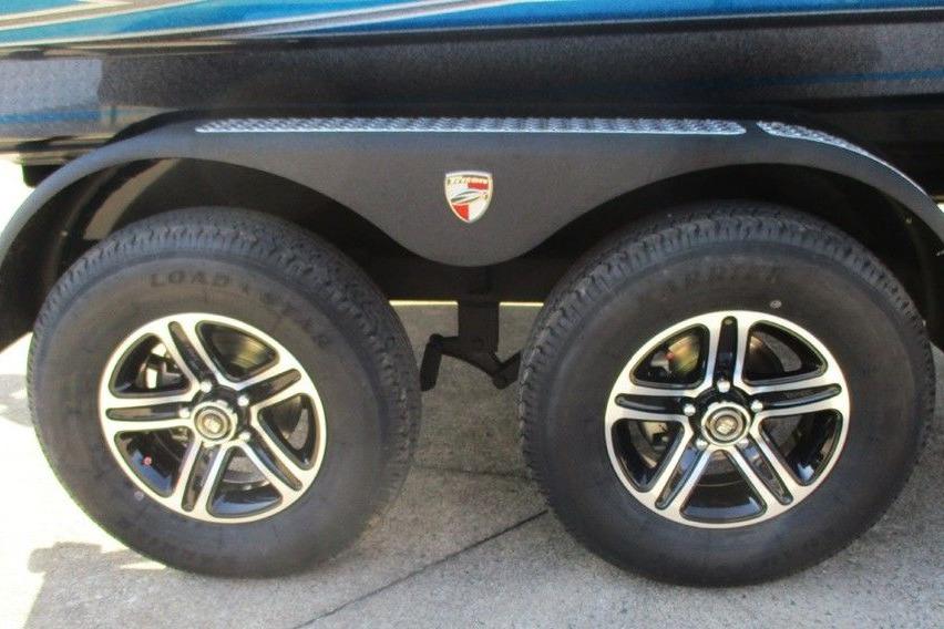 2026 Triton 18 TrX trailer wheels with black alloy rims and branded fender.