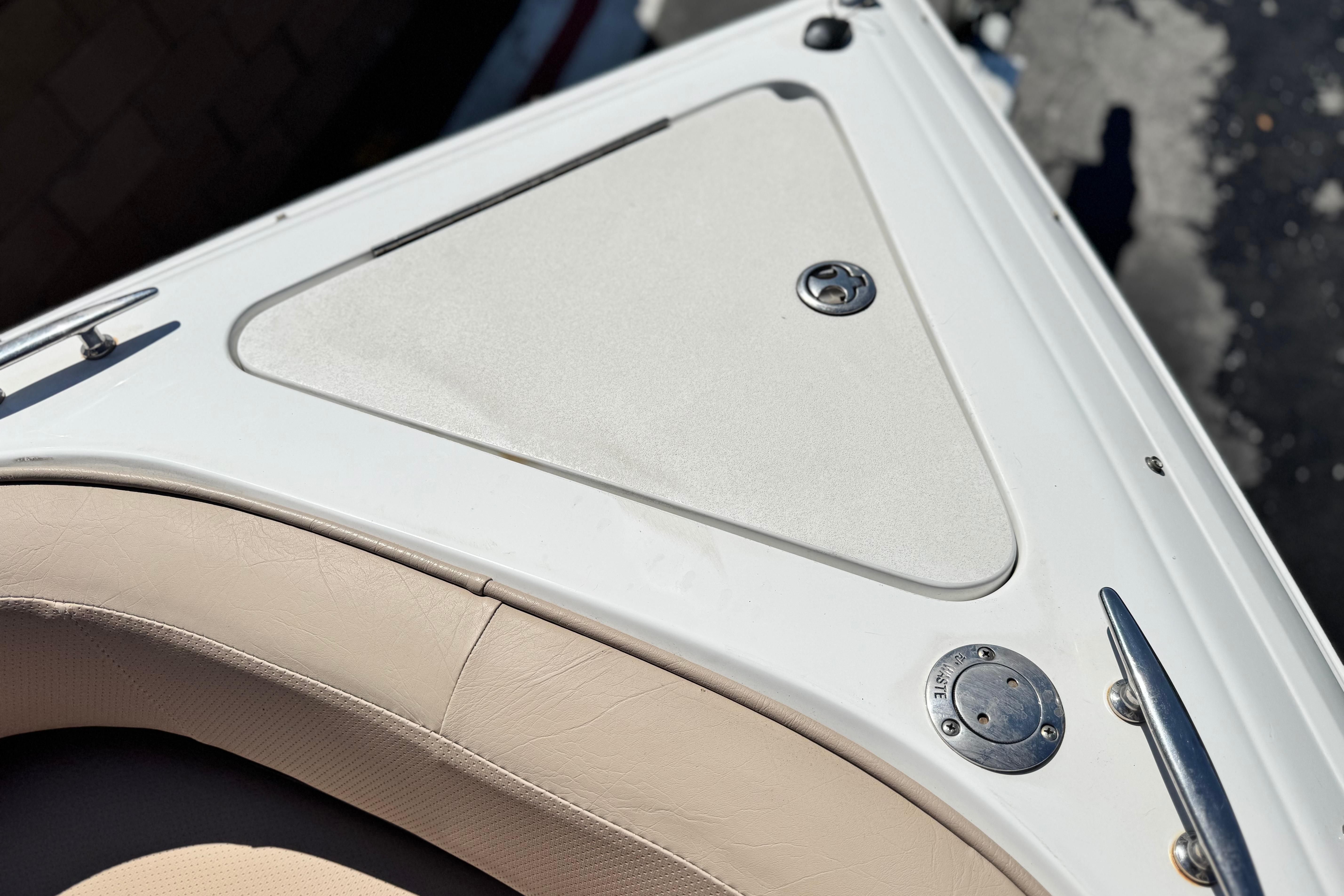 2008 Cobalt 262 boat deck with beige seating and metal fixtures.