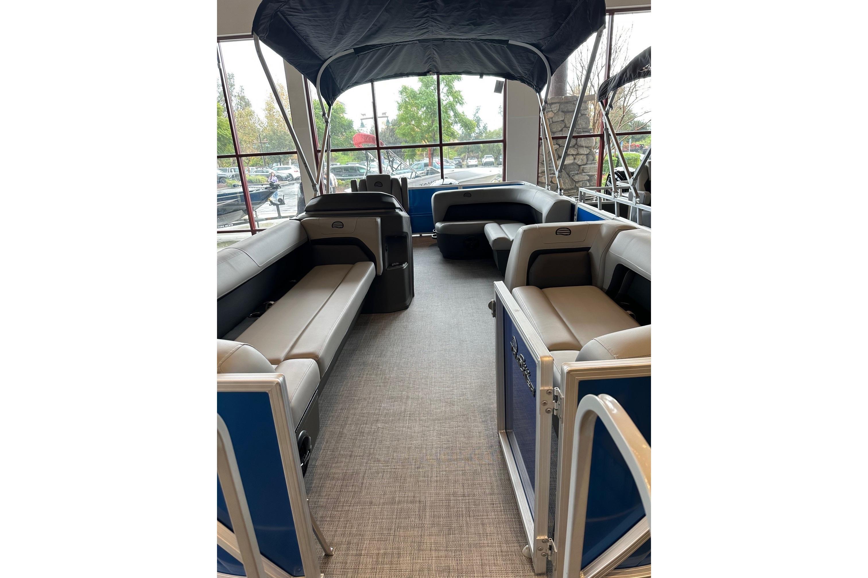 2026 Sun Tracker Party Barge 18 DLX interior with spacious seating and canopy.