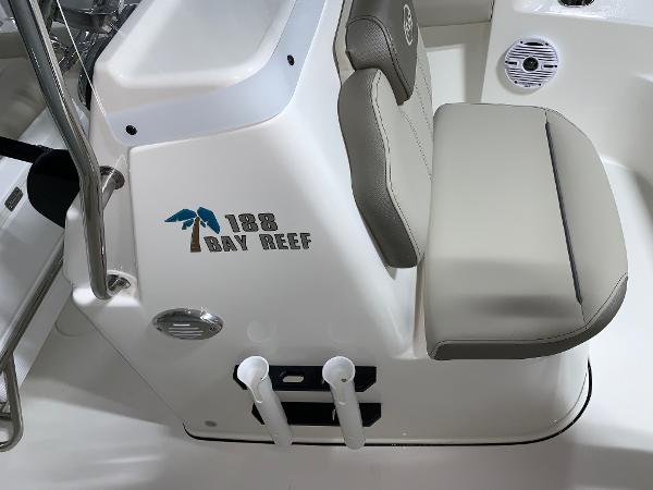 2026 Key West 188 Bay Reef boat interior with cushioned seating and logo.