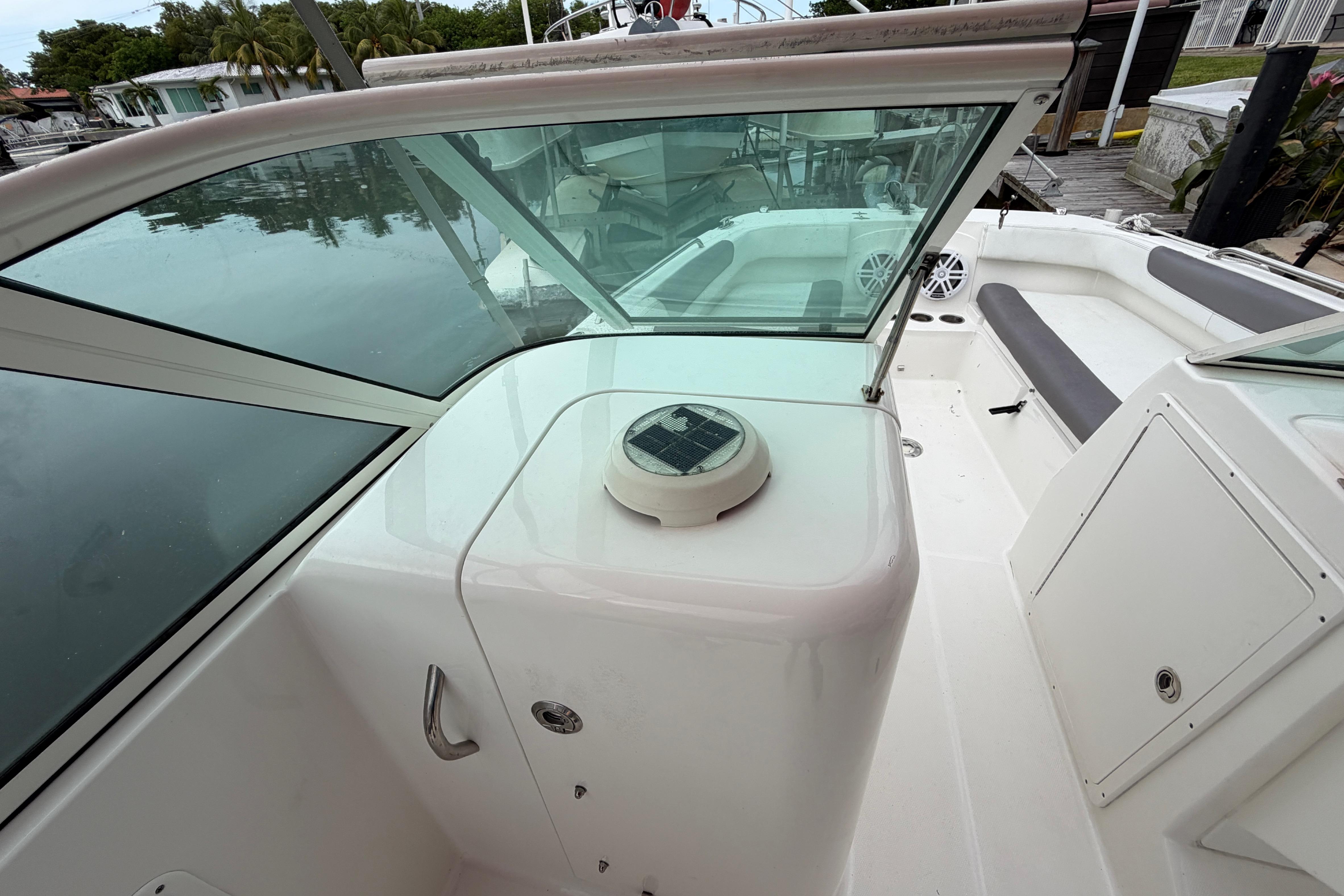2019 World Cat 230 DC boat interior with seating and storage compartments.