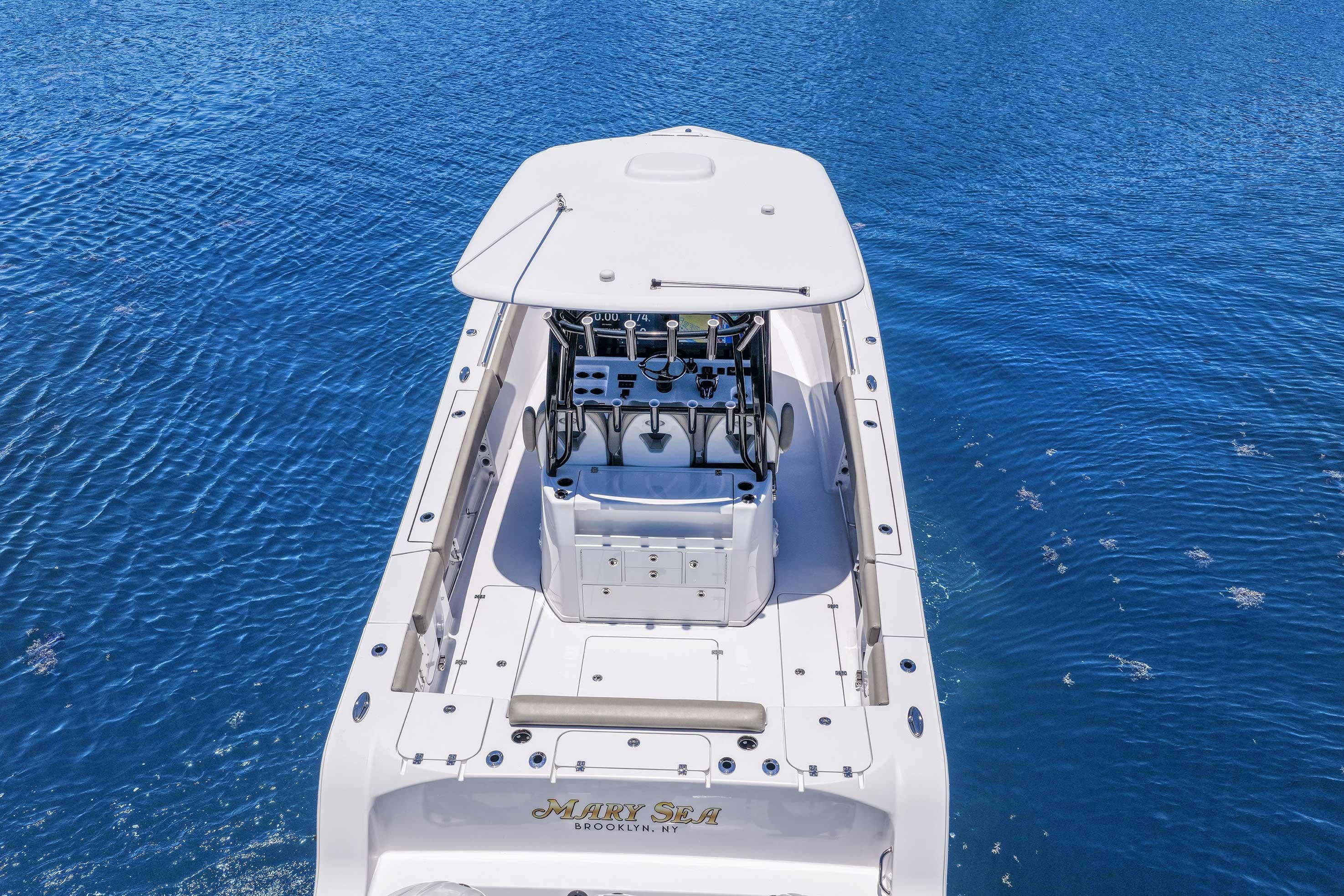 2024 Sportsman Open 352 Center Console boat on blue water, aerial view.