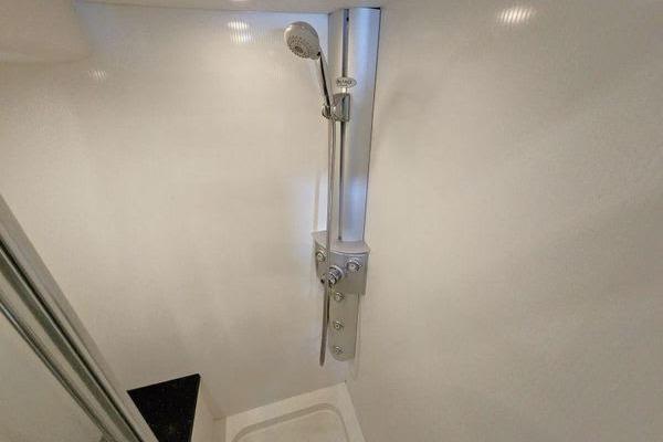 Shower area in 2005 Sunseeker Manhattan 66 yacht, featuring modern fixtures.