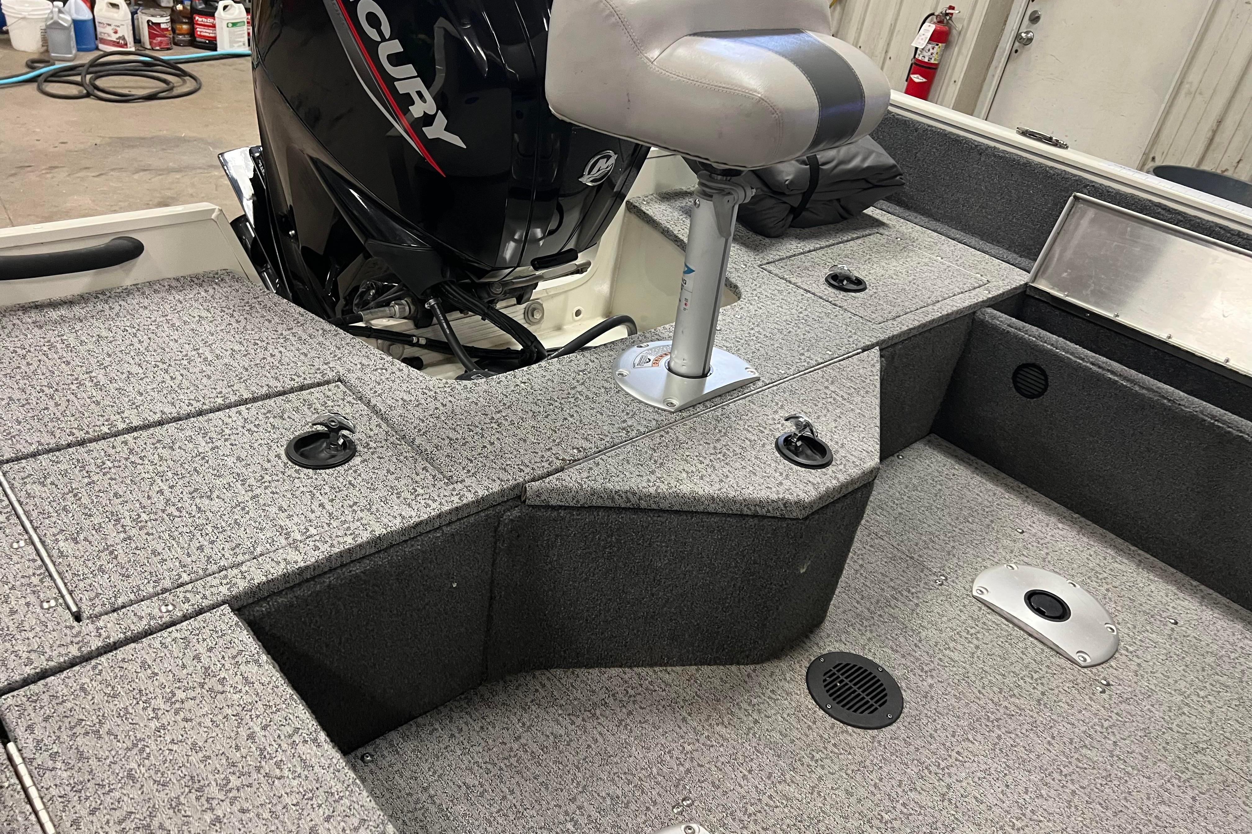 2022 Tracker Pro Guide V-16 WT boat interior with Mercury engine and seating.