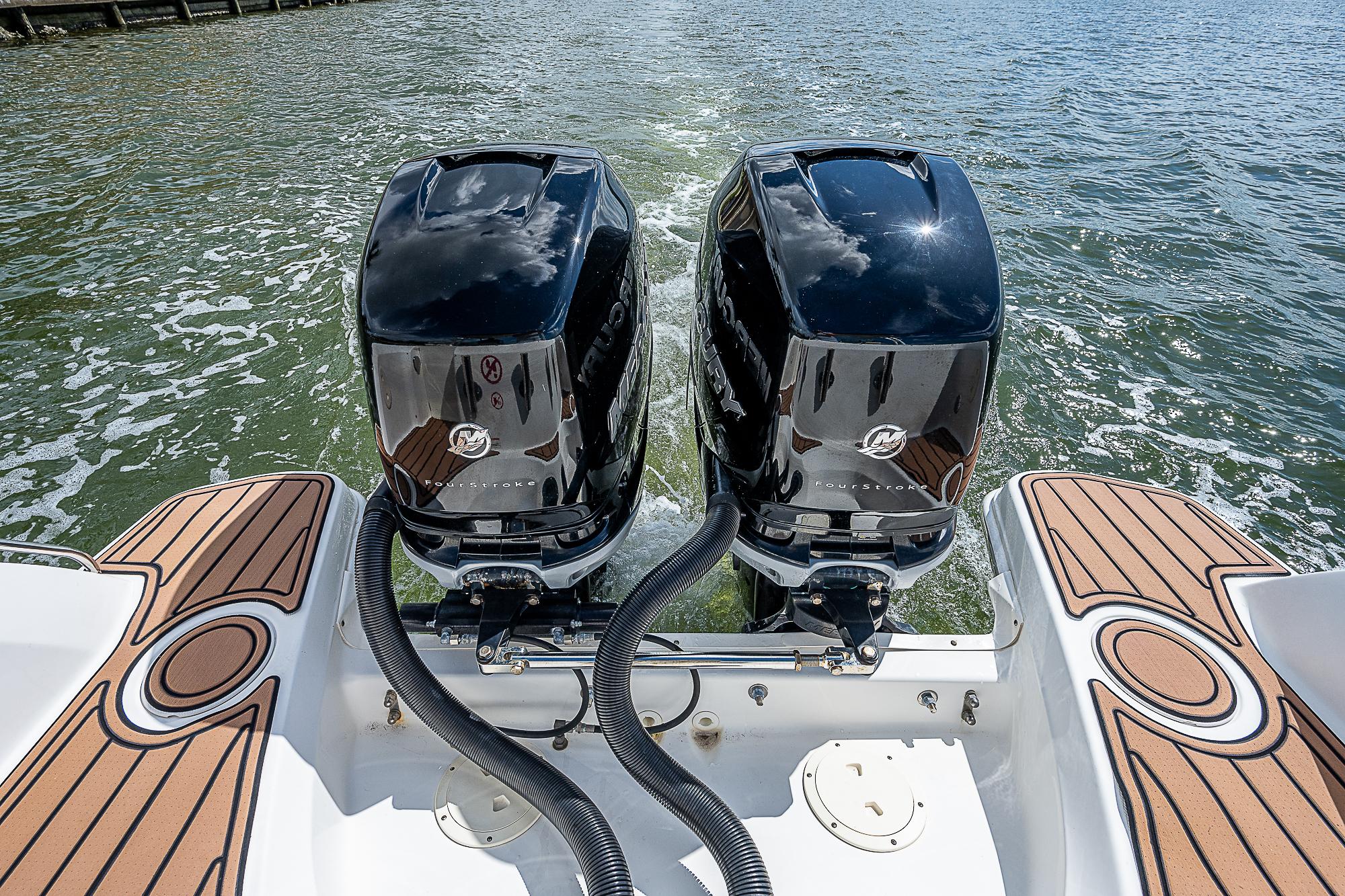2018 Boston Whaler 270 Vantage with dual outboard engines on water.