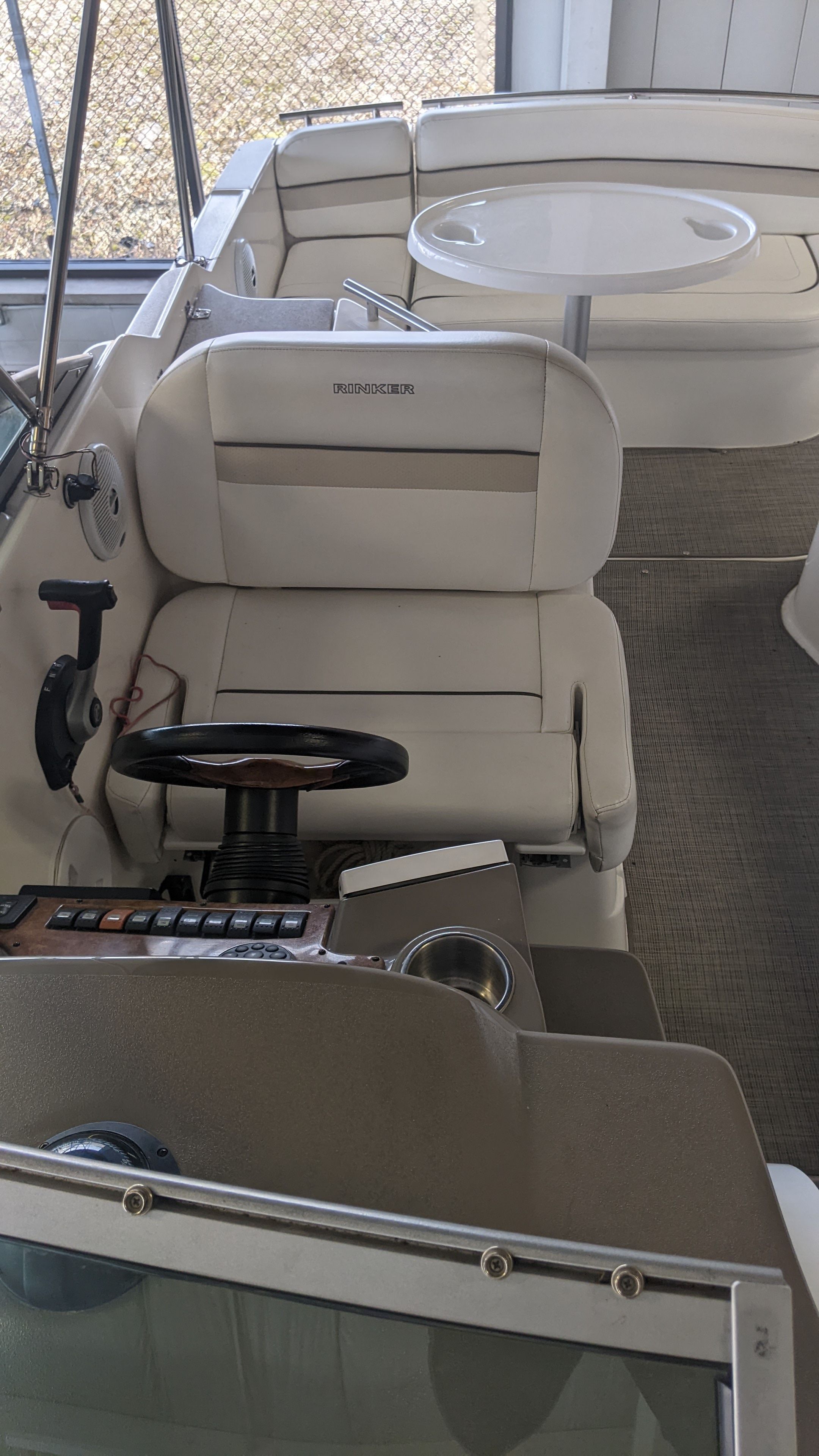 Interior of a 2006 Rinker 250 EC boat with helm station.