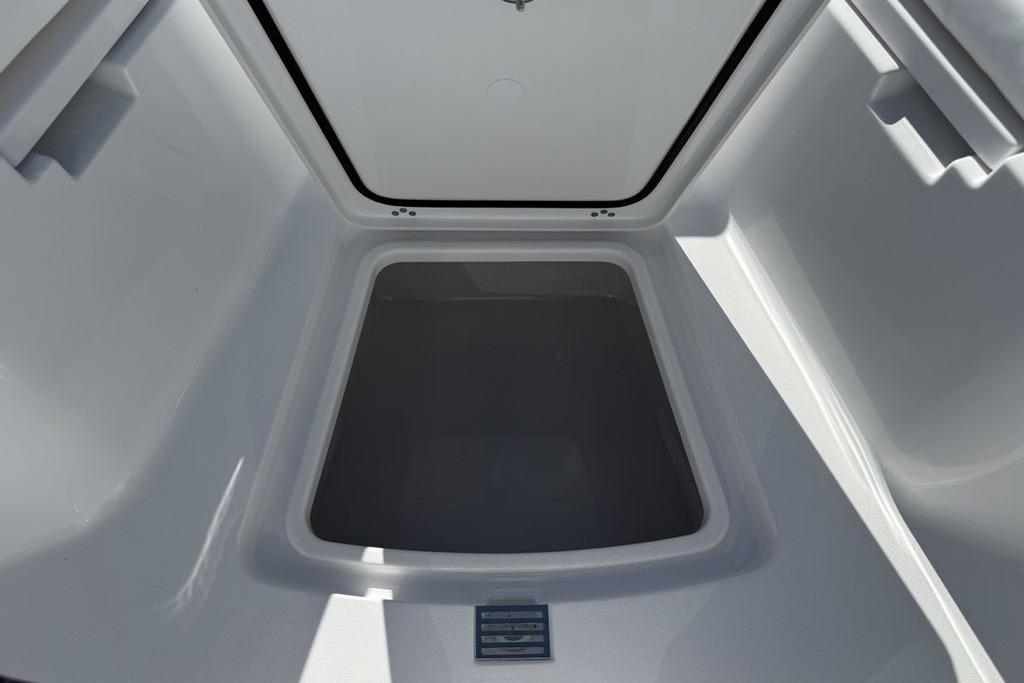 Storage compartment of 2026 Sportsman Open 232 Center Console boat, interior view.