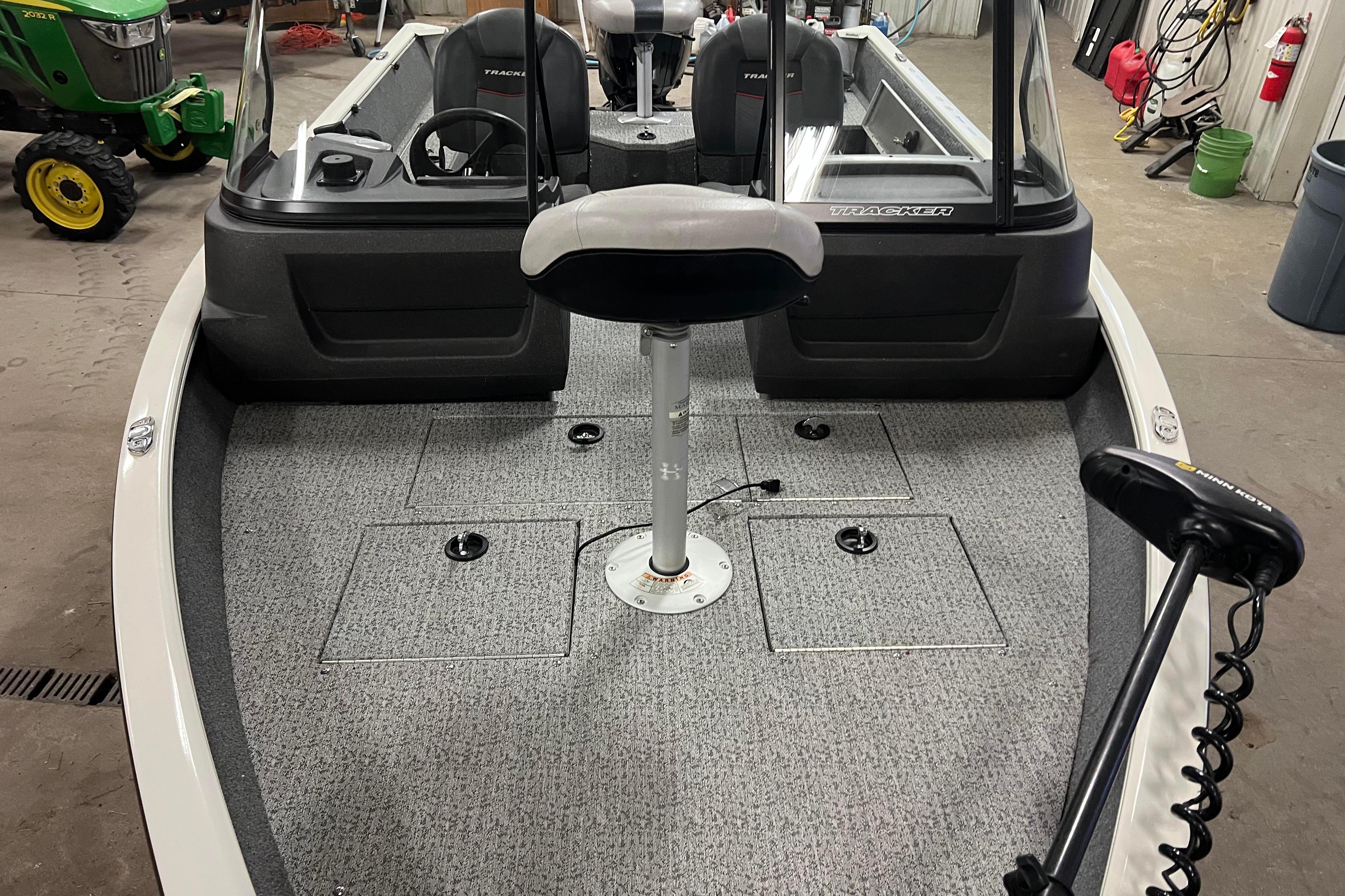 2022 Tracker Pro Guide V-16 WT boat interior with seating and equipment.
