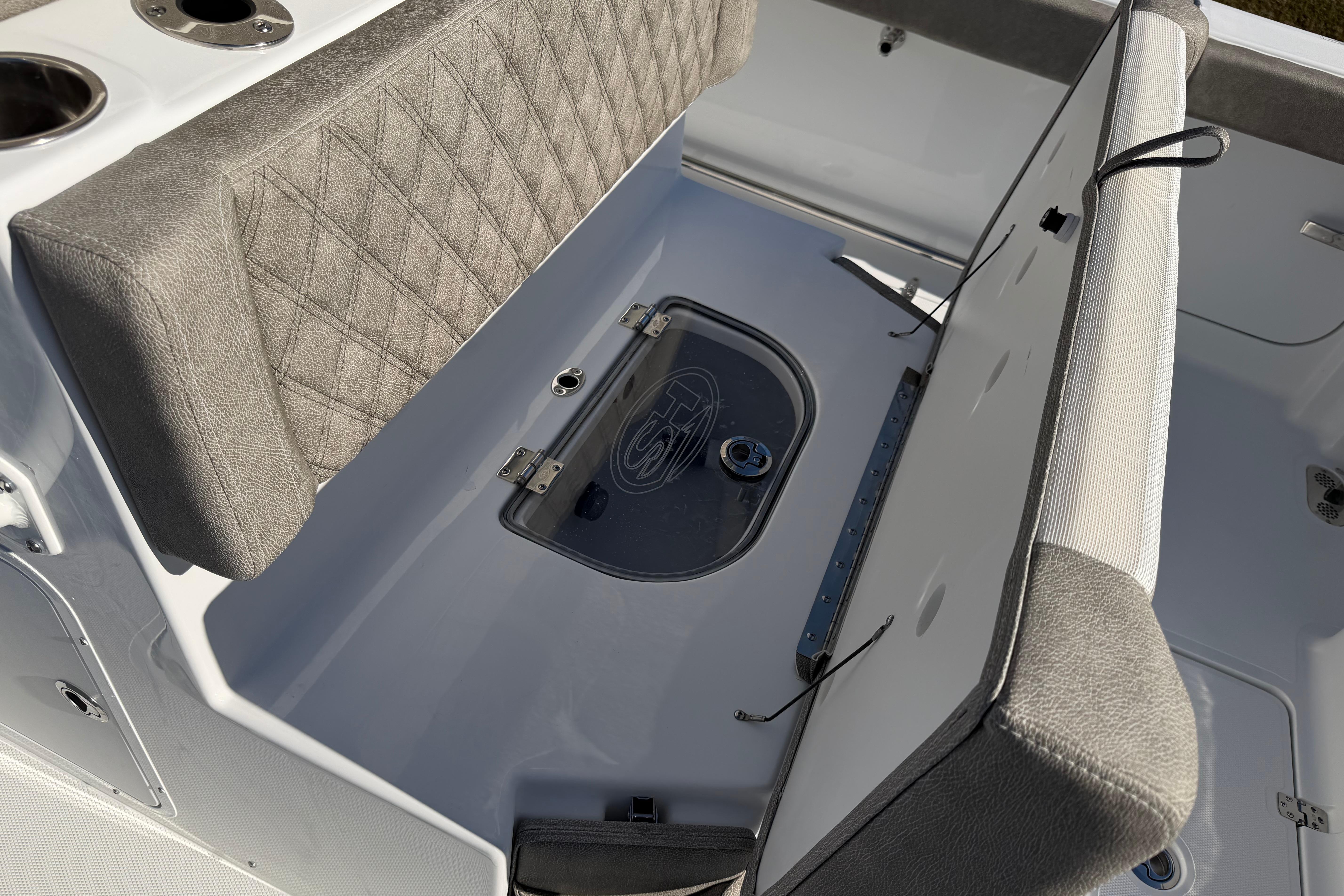 2026 Sea Hunt Ultra 275 Coffin Box interior with cushioned seating and storage.